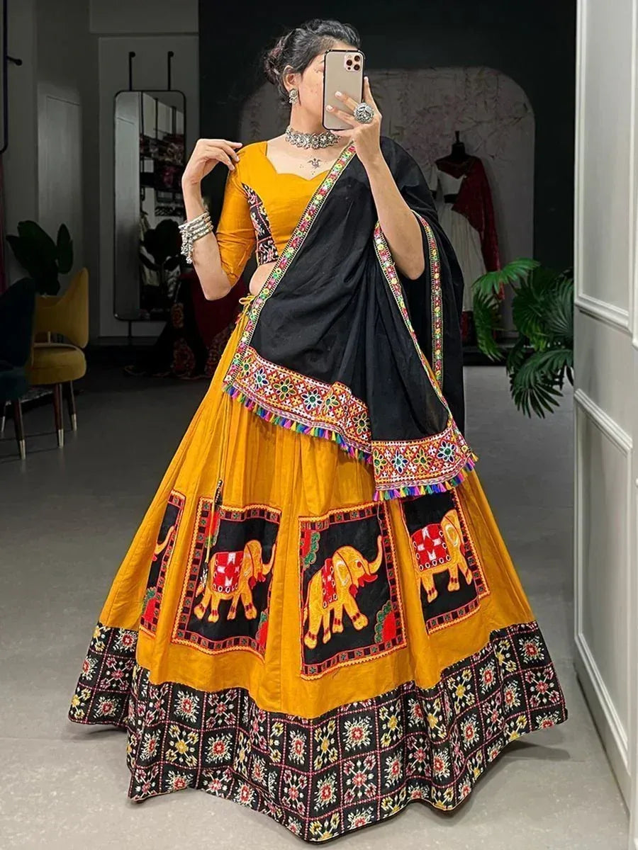 Yellow and black embroidered lehenga choli with elephant motifs, perfect for Indian ethnic wear occasions.
