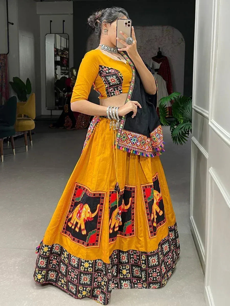 Yellow and black embroidered lehenga choli with elephant motifs, perfect for Indian ethnic wear occasions.