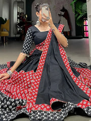 Flaunting Red-Black Printed Cotton Navratri Lehenga Choli with Purse