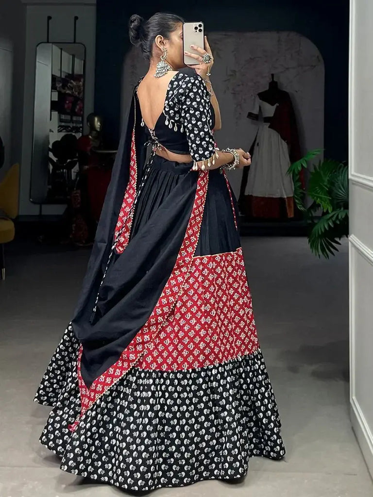 Flaunting Red-Black Printed Cotton Navratri Lehenga Choli with Purse