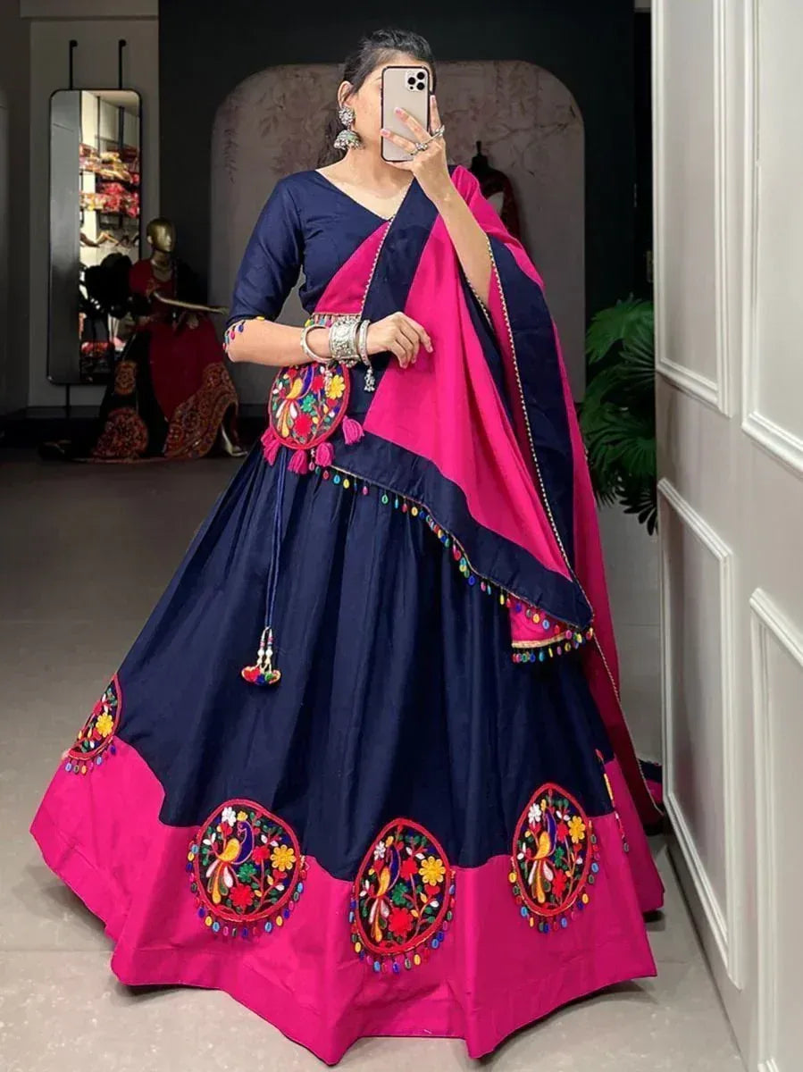 Navy blue and pink embroidered lehenga choli with mirror work and tassels, perfect for Indian ethnic occasions
