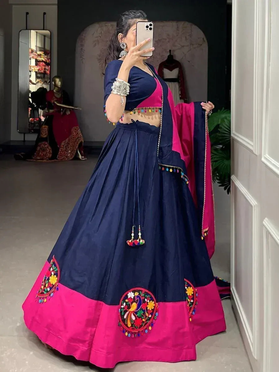 Navy blue and pink embroidered lehenga choli with mirror work, perfect for Indian ethnic wear occasions.