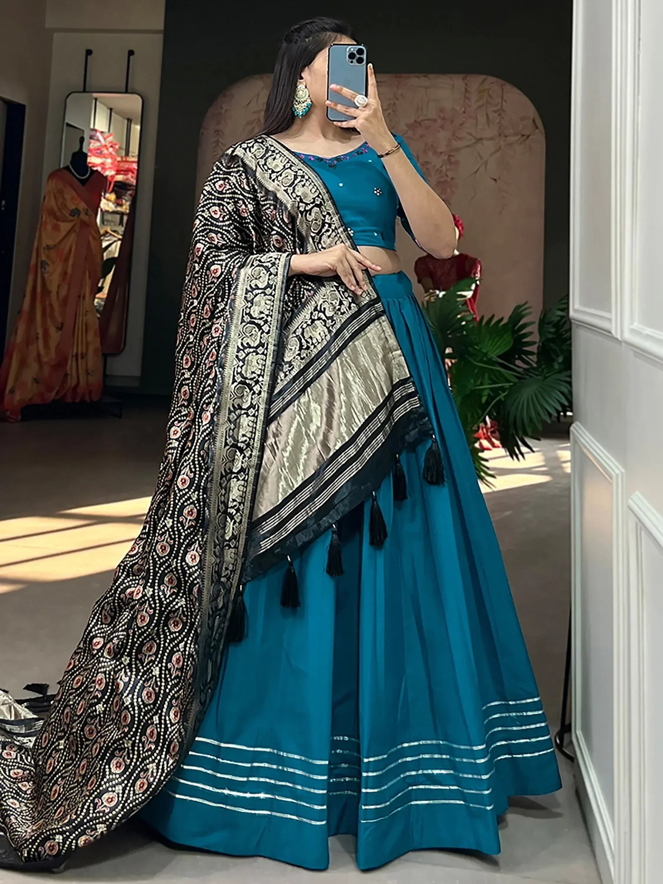 Teal lehenga choli with black and gold printed dupatta, ethnic Indian wear for women