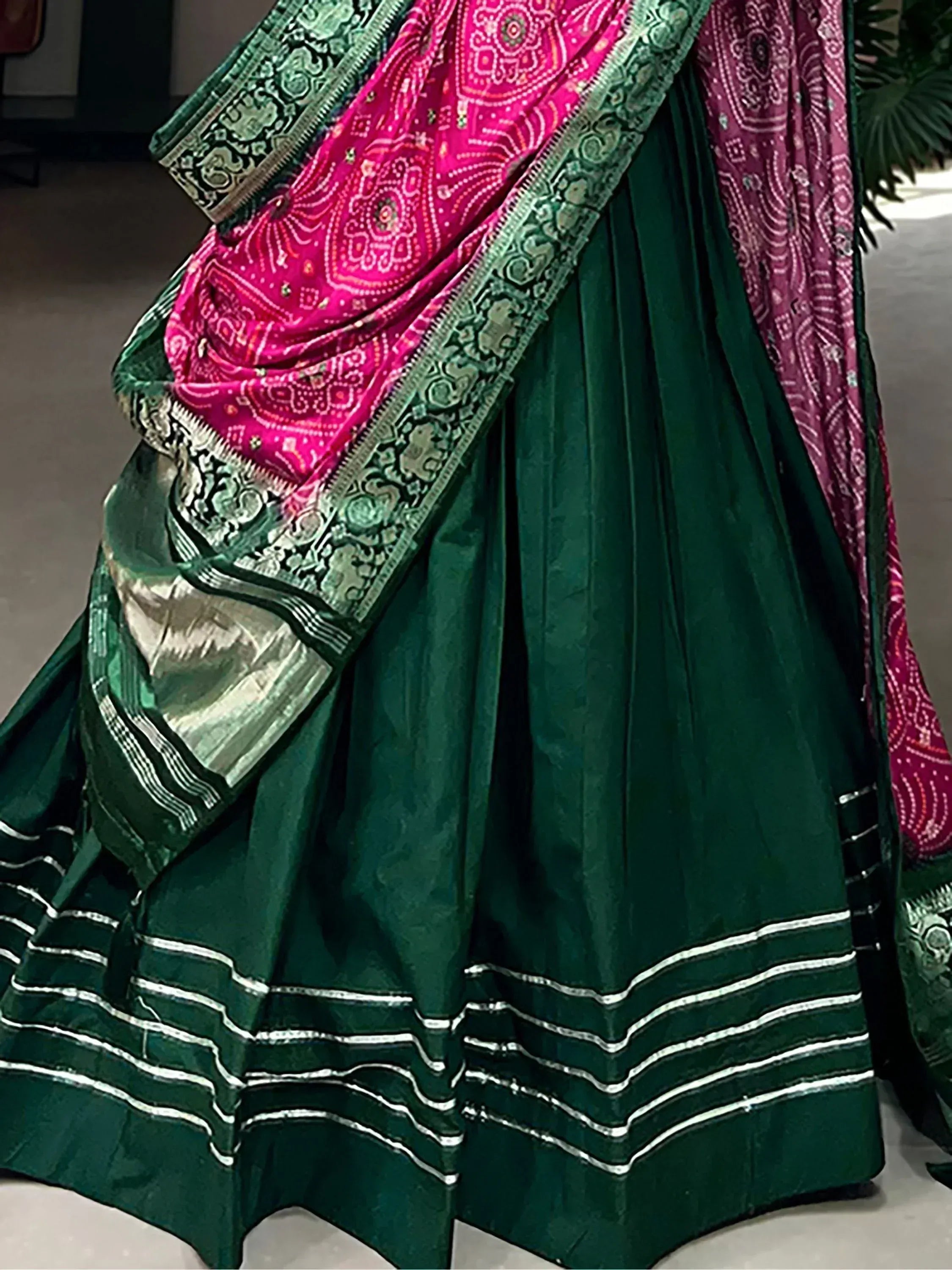 Emerald green lehenga with pink bandhani dupatta, ethnic Indian wear for weddings and festivals