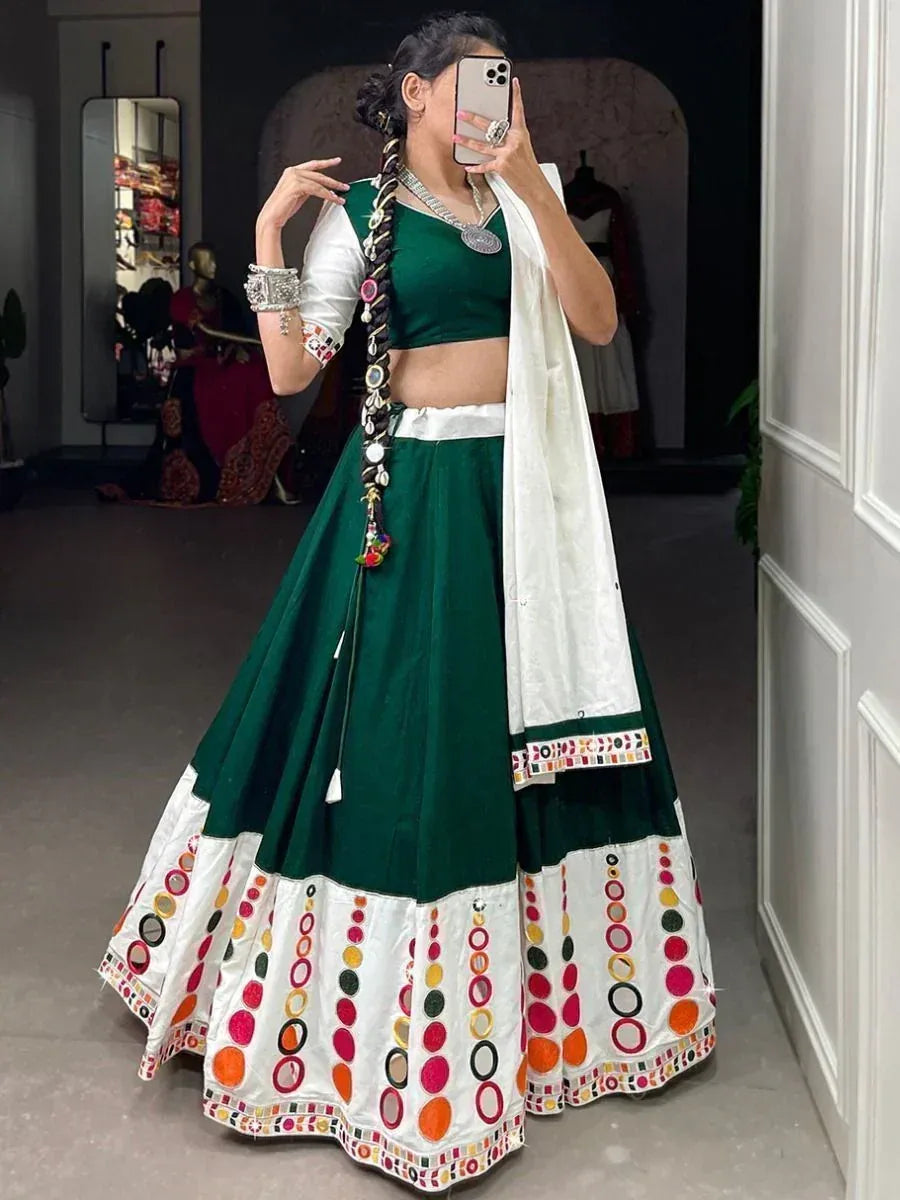 Green and white embroidered lehenga choli with mirror work, perfect for Indian ethnic wear occasions