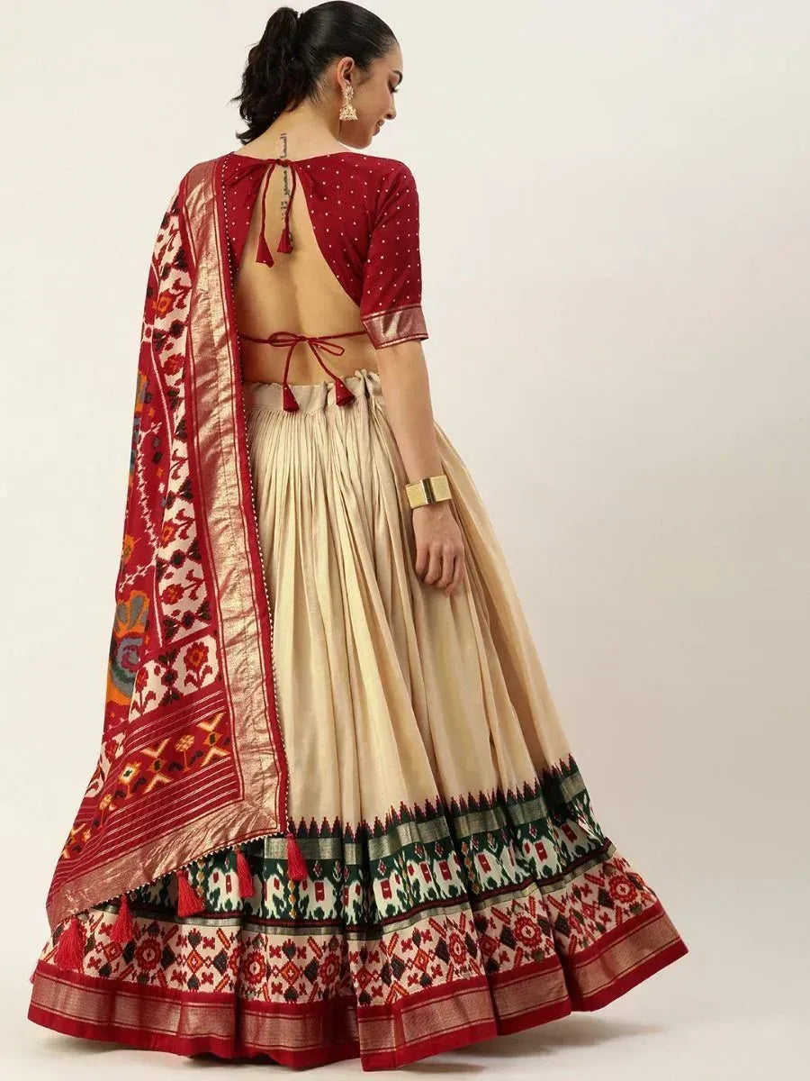 Back view of woman in red and beige lehenga choli with embroidered dupatta, ethnic Indian wear