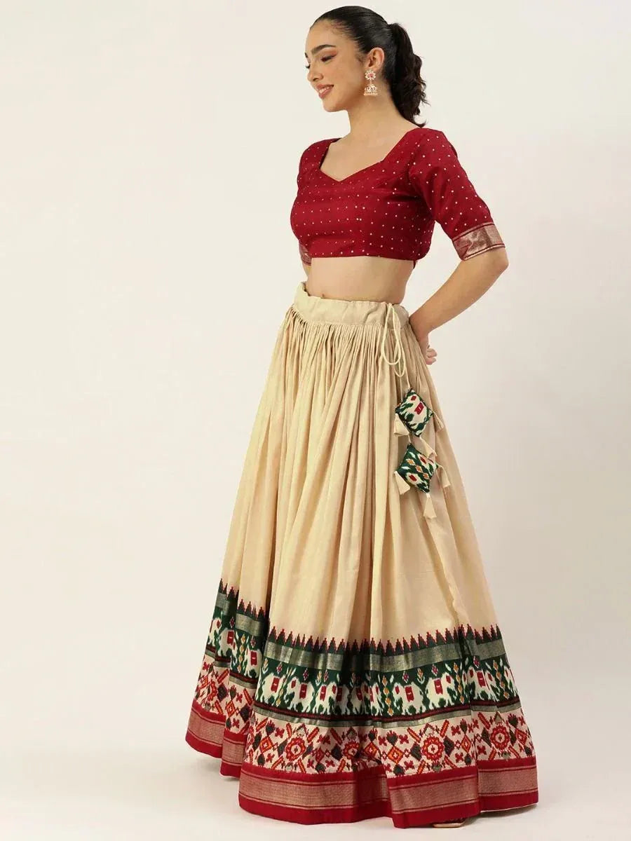 Maroon polka dot crop top with beige lehenga featuring ethnic border print, perfect for Indian ethnic wear