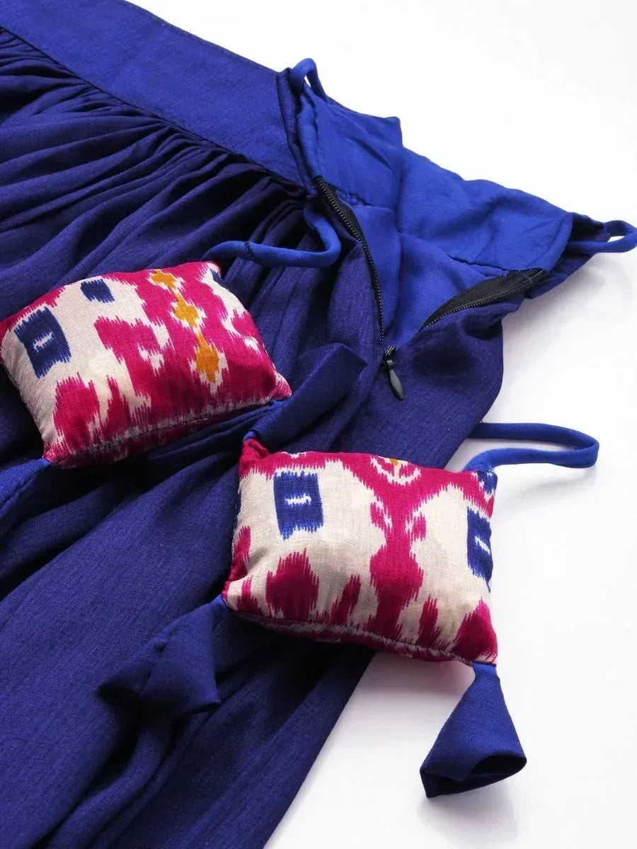 Royal blue ethnic gown with ikat patterned pouches, perfect for Indian festive wear