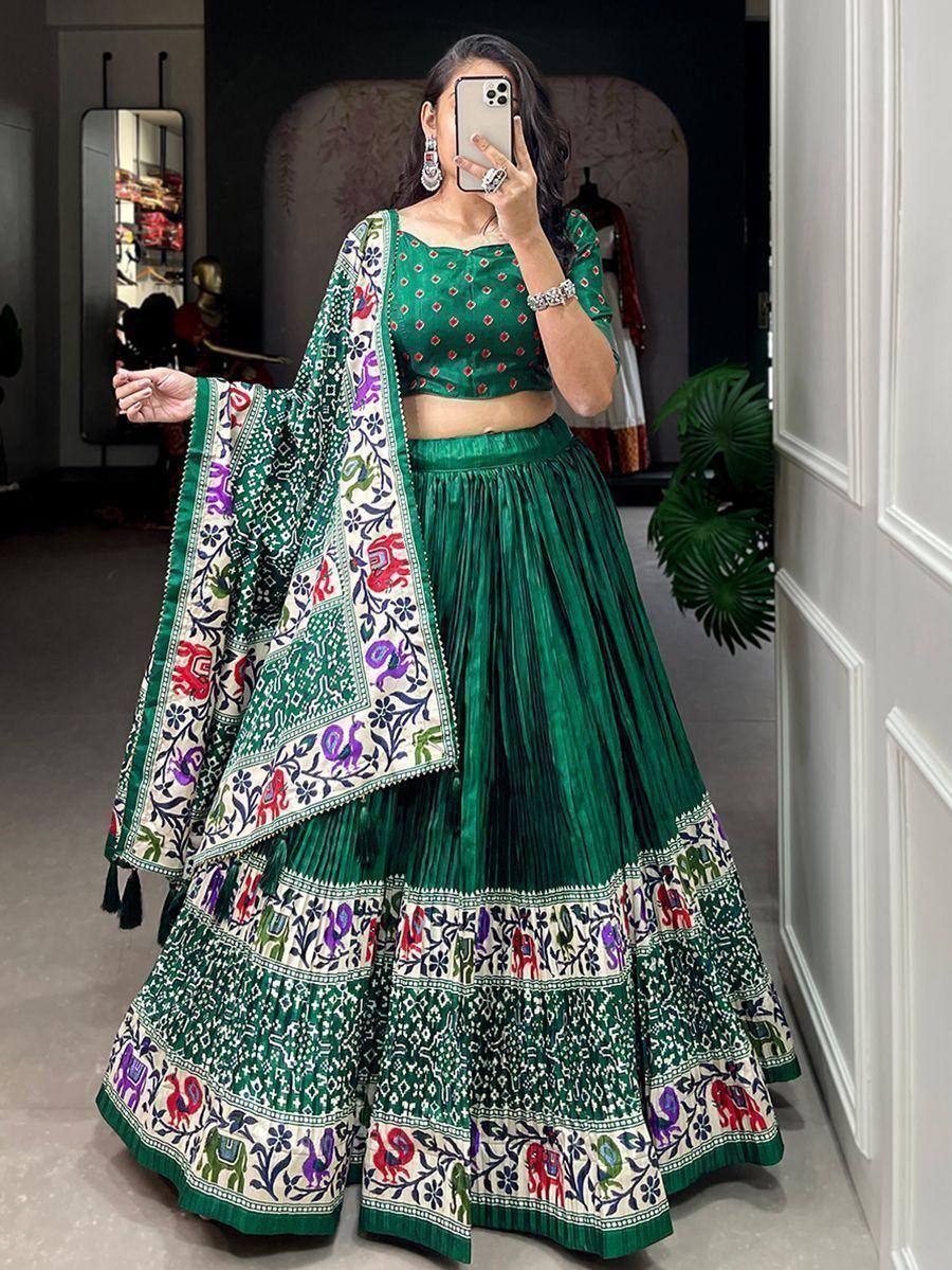 Green embroidered lehenga choli with colorful elephant print dupatta, ethnic Indian wear