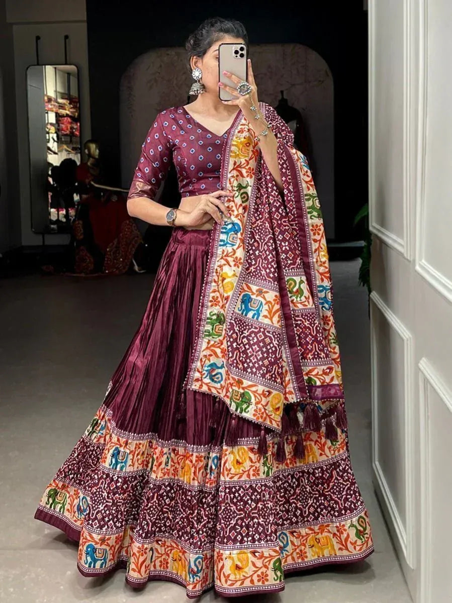 Maroon printed lehenga choli with elephant motifs, perfect for Indian ethnic wear and festive occasions