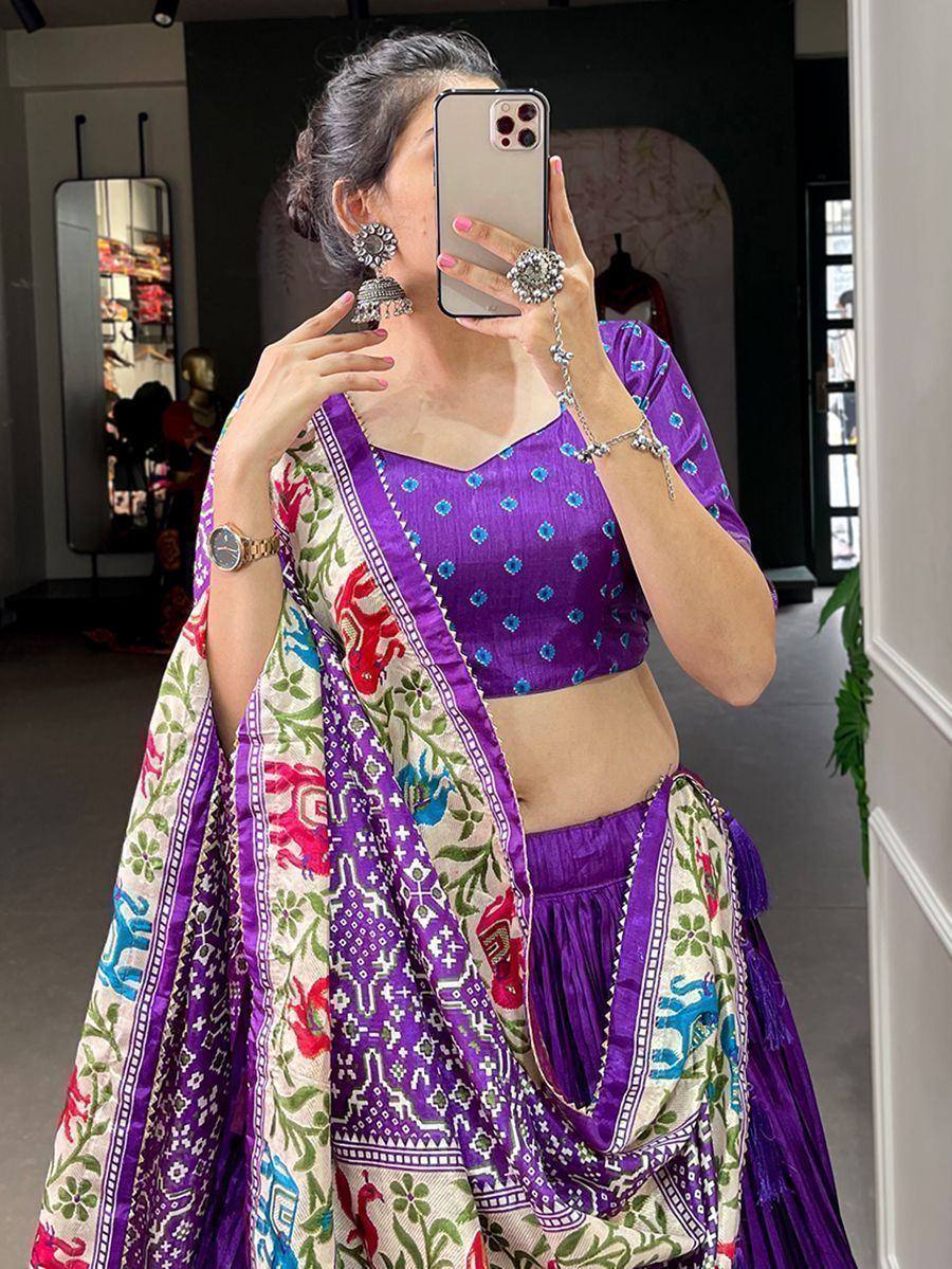 Purple printed lehenga choli with colorful elephant motifs, perfect for Indian ethnic wear occasions.
