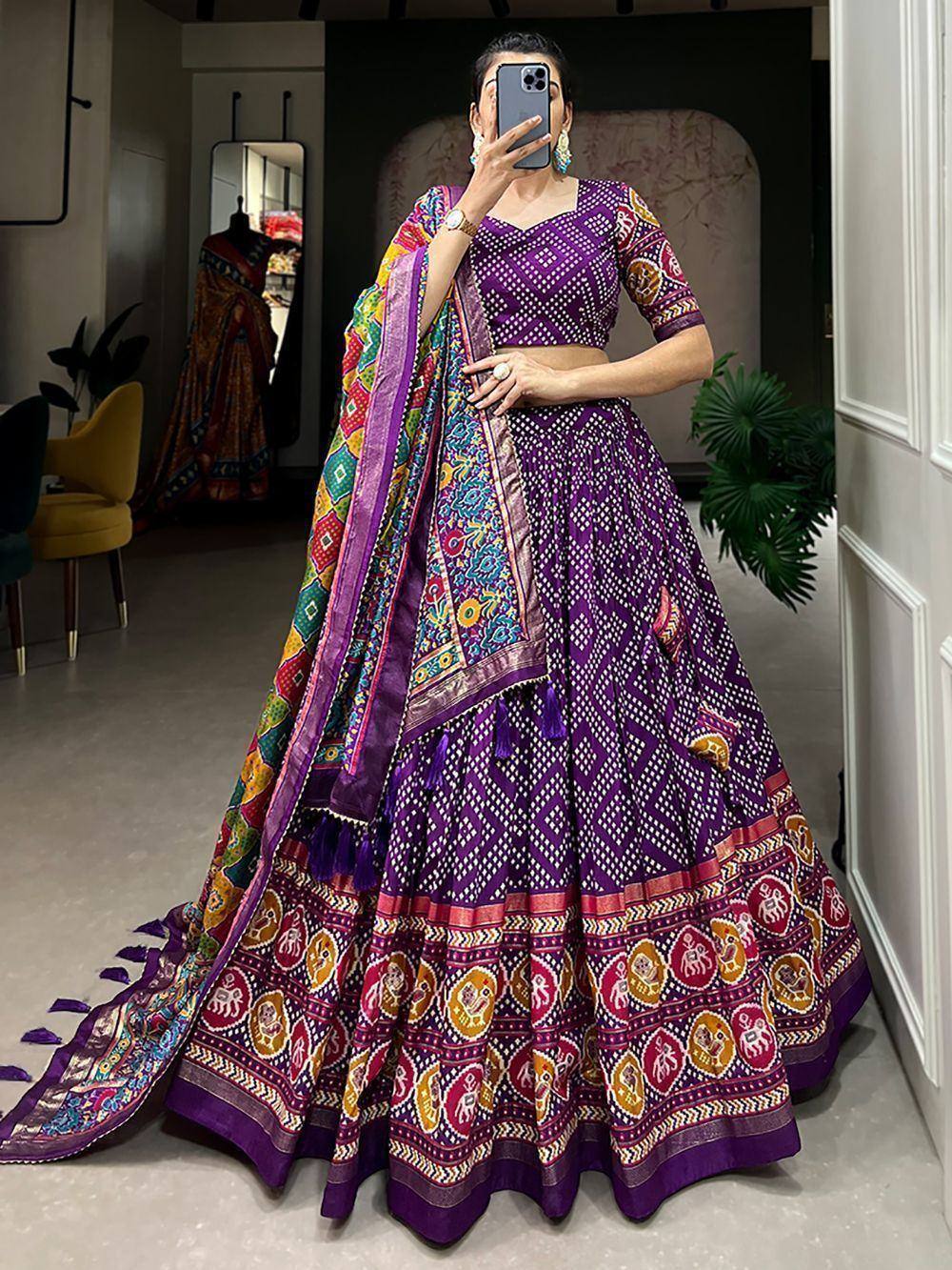 Purple printed lehenga choli with colorful dupatta, ethnic Indian wear for weddings and festivals