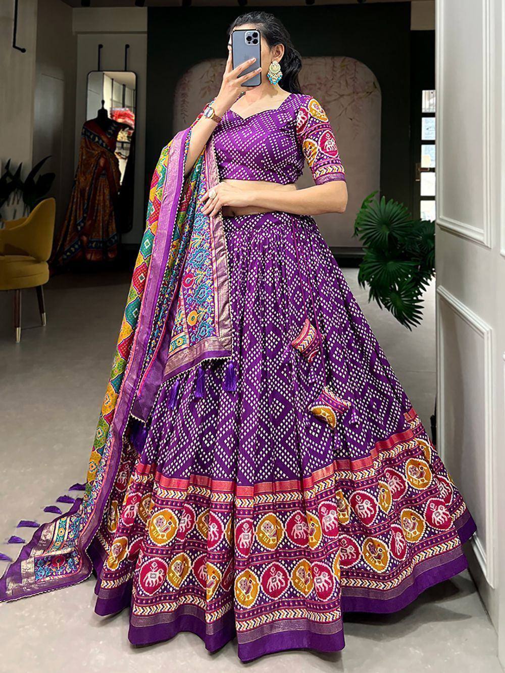Purple printed lehenga choli with colorful elephant motifs and matching dupatta, perfect for Indian ethnic wear.