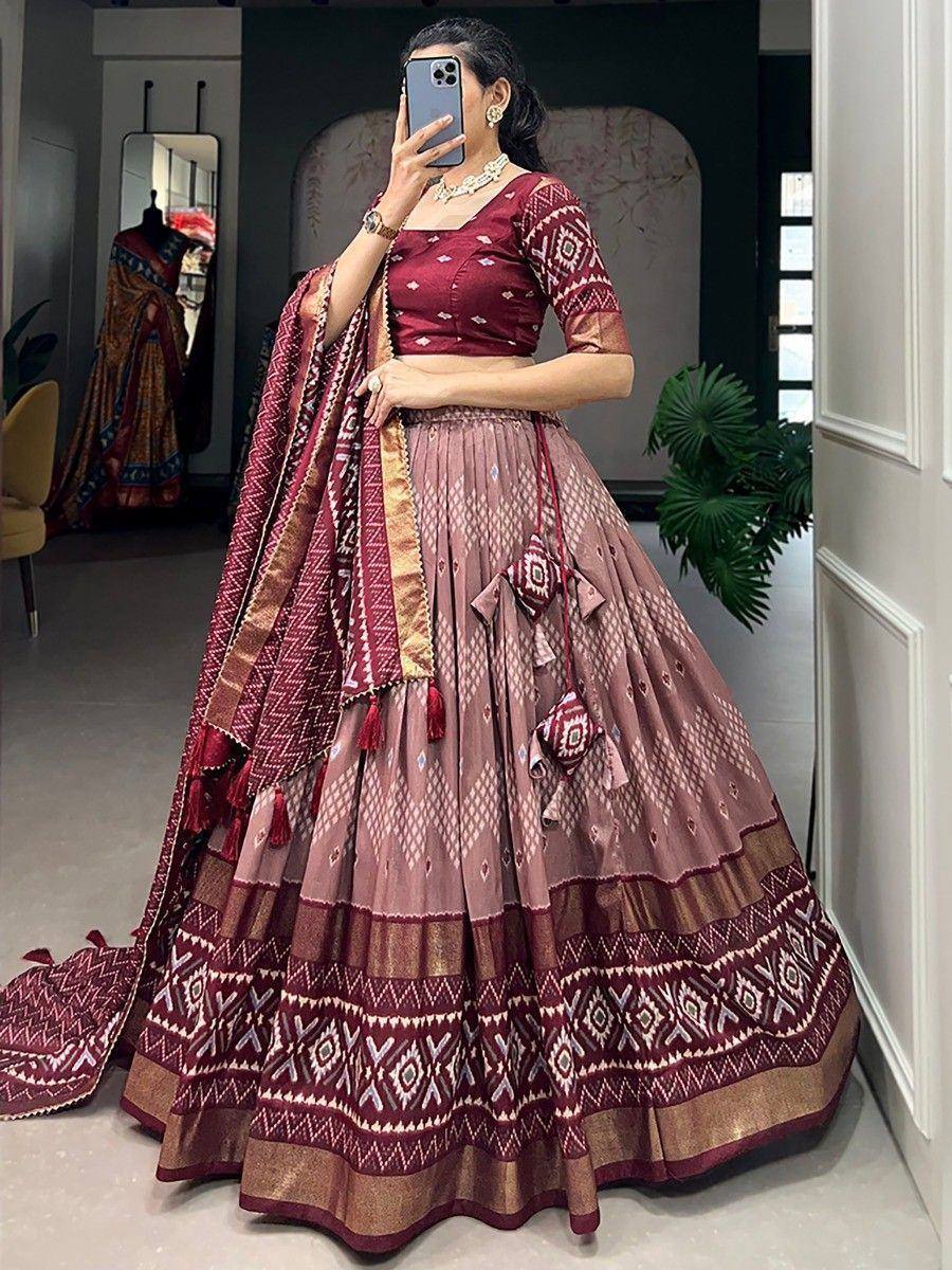 Maroon and pink printed lehenga choli with geometric patterns, perfect for Indian ethnic wear occasions.