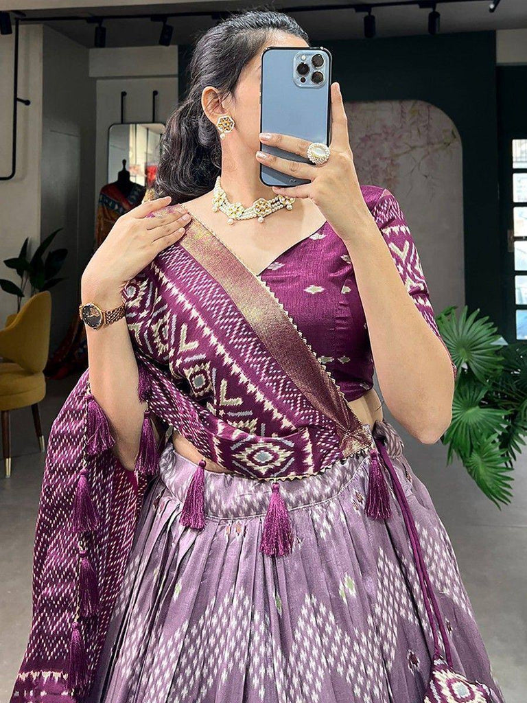 Purple ikat print lehenga choli with tassels, perfect for ethnic occasions and Indian festivals