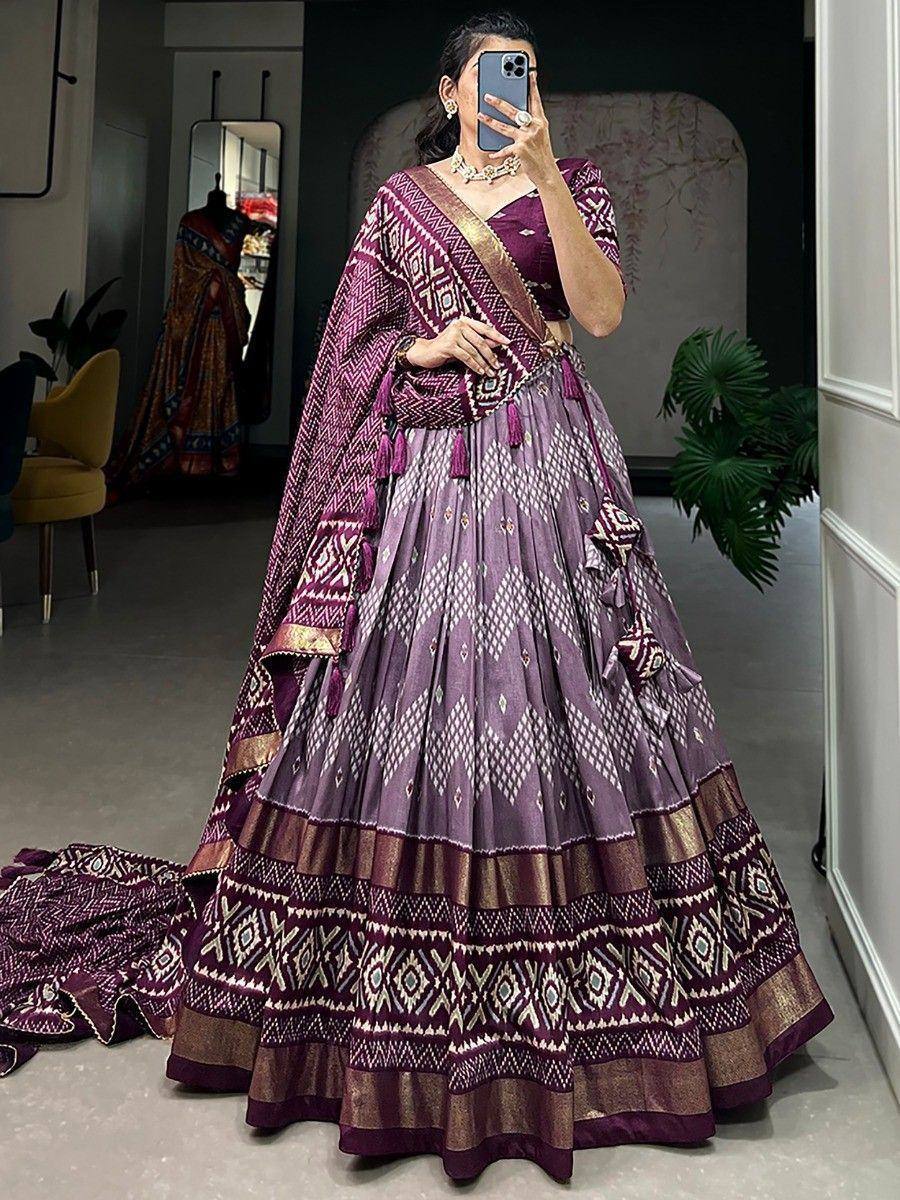 Purple designer lehenga choli with geometric print and gold trim, perfect for Indian ethnic wear occasions