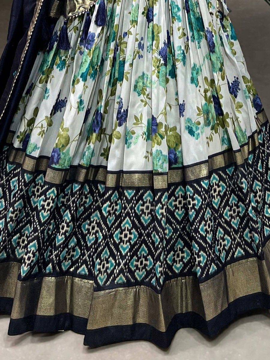 Floral print lehenga skirt with navy blue geometric border and gold trim, ethnic wear