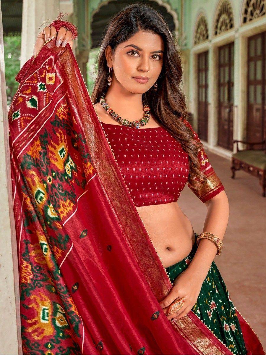 Red and green ethnic lehenga choli with printed dupatta, perfect for Indian weddings and festivals