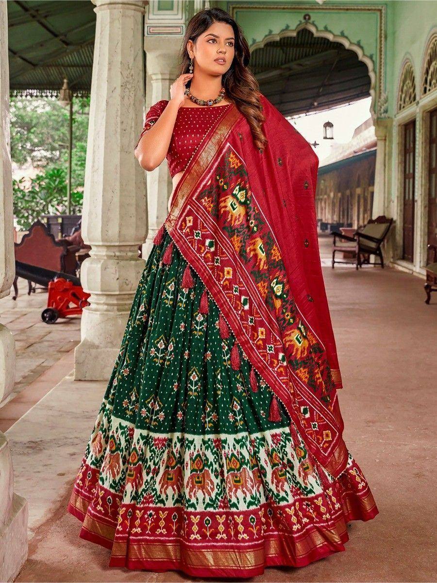 Red and green printed lehenga choli with ethnic motifs, perfect for Indian weddings and festivals