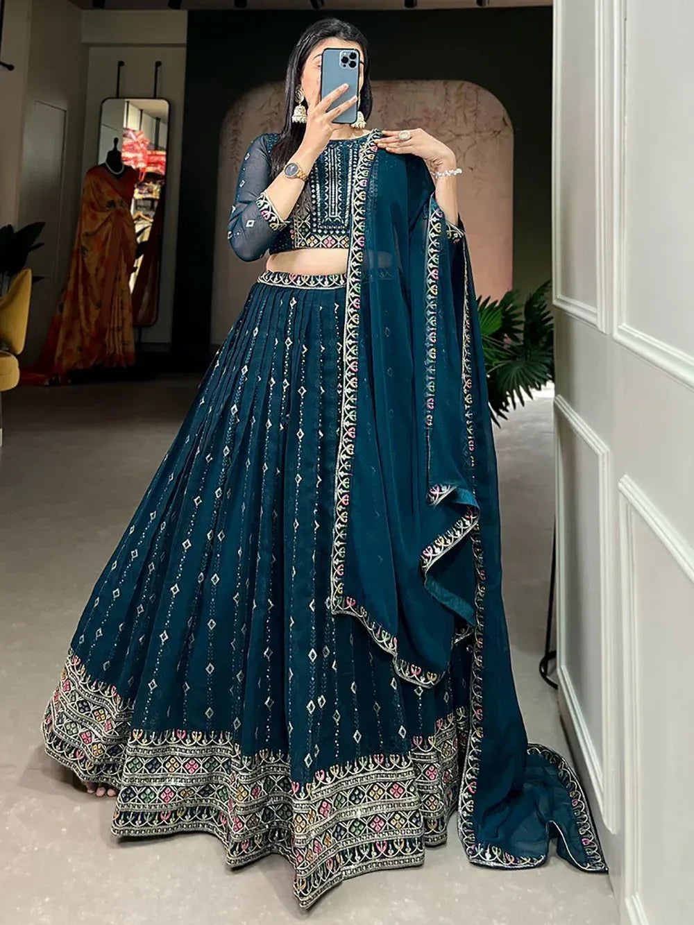 Teal embroidered lehenga choli with matching dupatta, perfect for Indian ethnic occasions