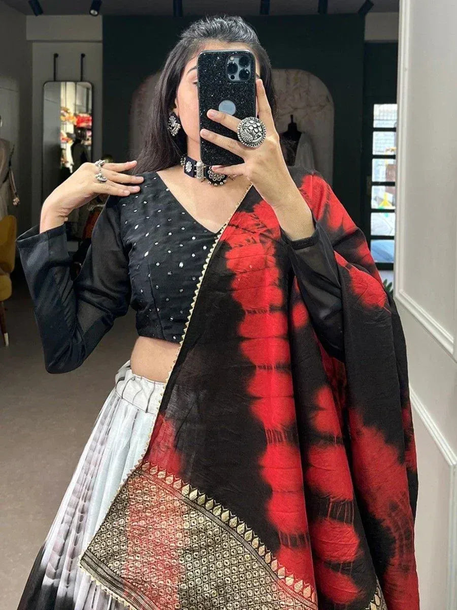 Black and red tie-dye lehenga choli with embellished blouse and dupatta, ethnic Indian wear