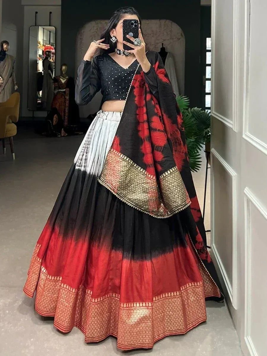 Black and red ombre lehenga choli with gold border, perfect for Indian ethnic occasions