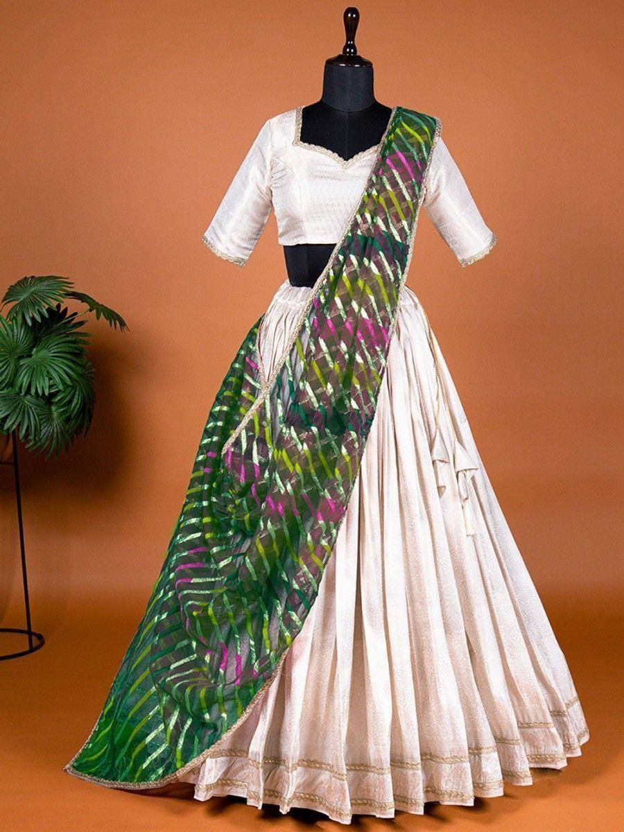 White lehenga choli with green and pink patterned dupatta, ethnic Indian wear for women