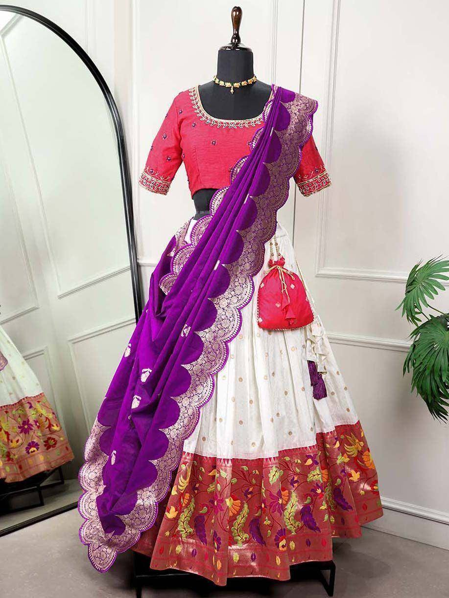 Vibrant purple and white lehenga choli with floral embroidery, perfect for Indian ethnic occasions.