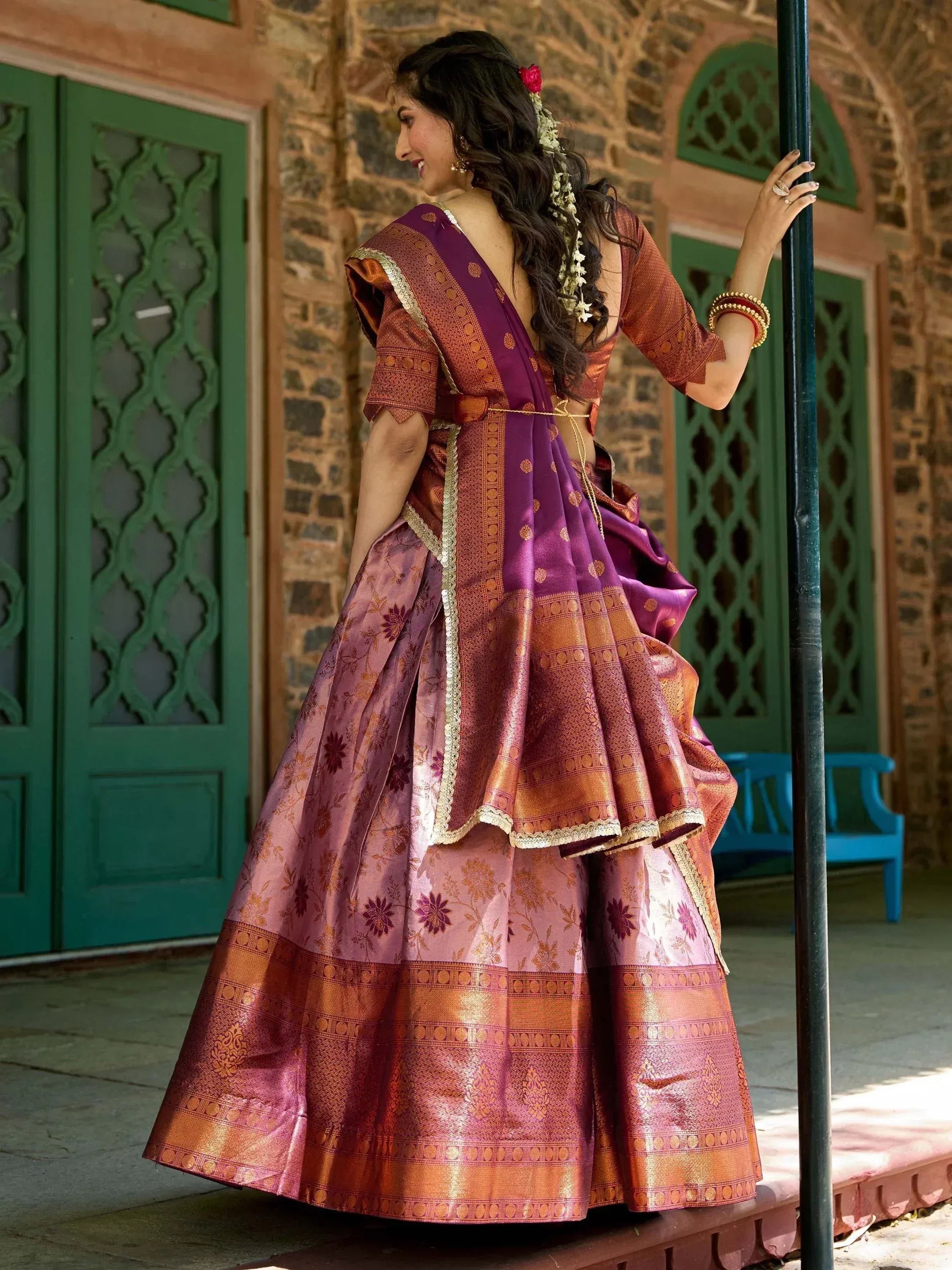 Elegant purple and gold lehenga choli with floral patterns, perfect for Indian ethnic wear.