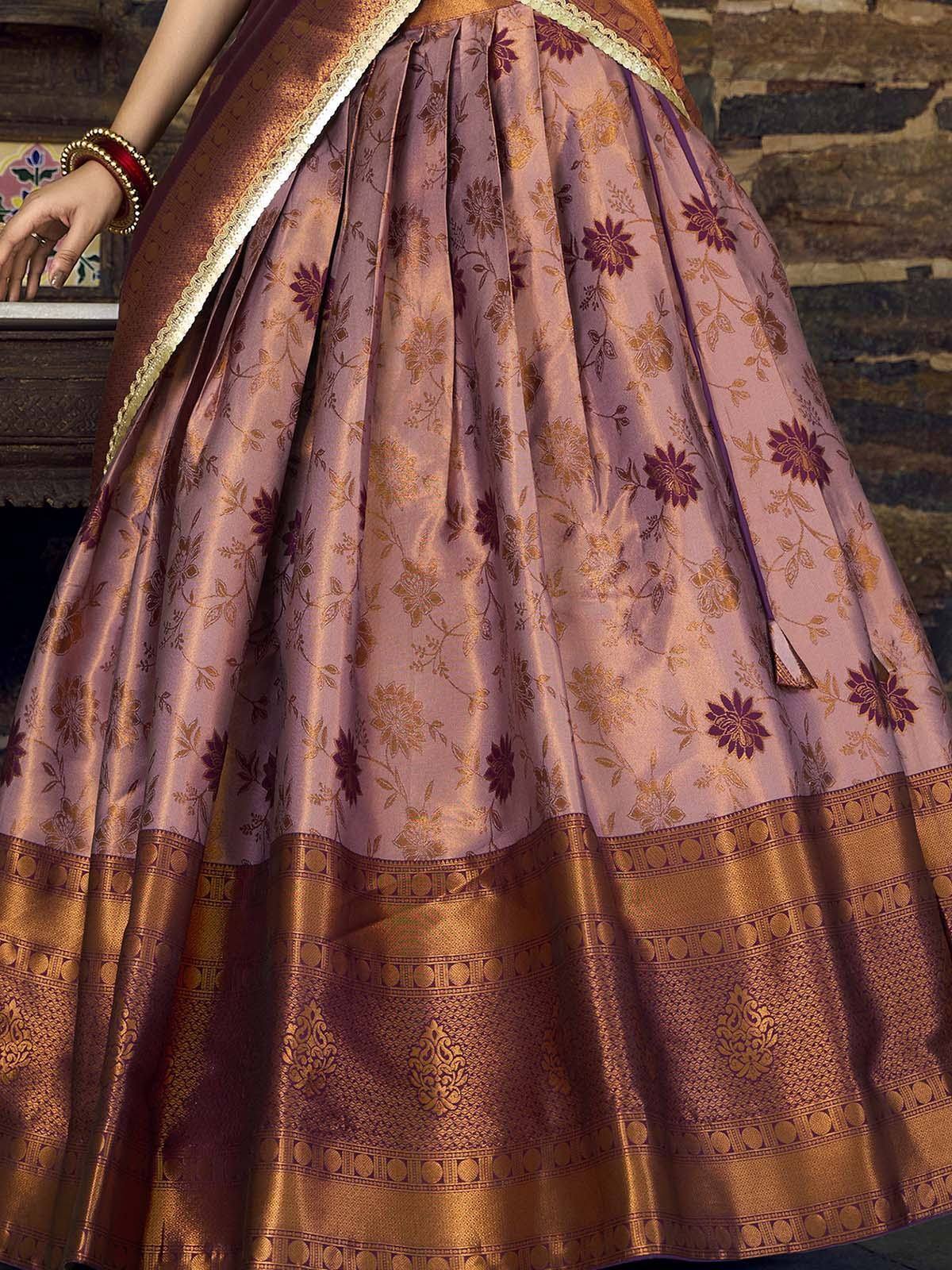 Elegant Indian ethnic lehenga with floral prints and golden border, perfect for festive occasions.