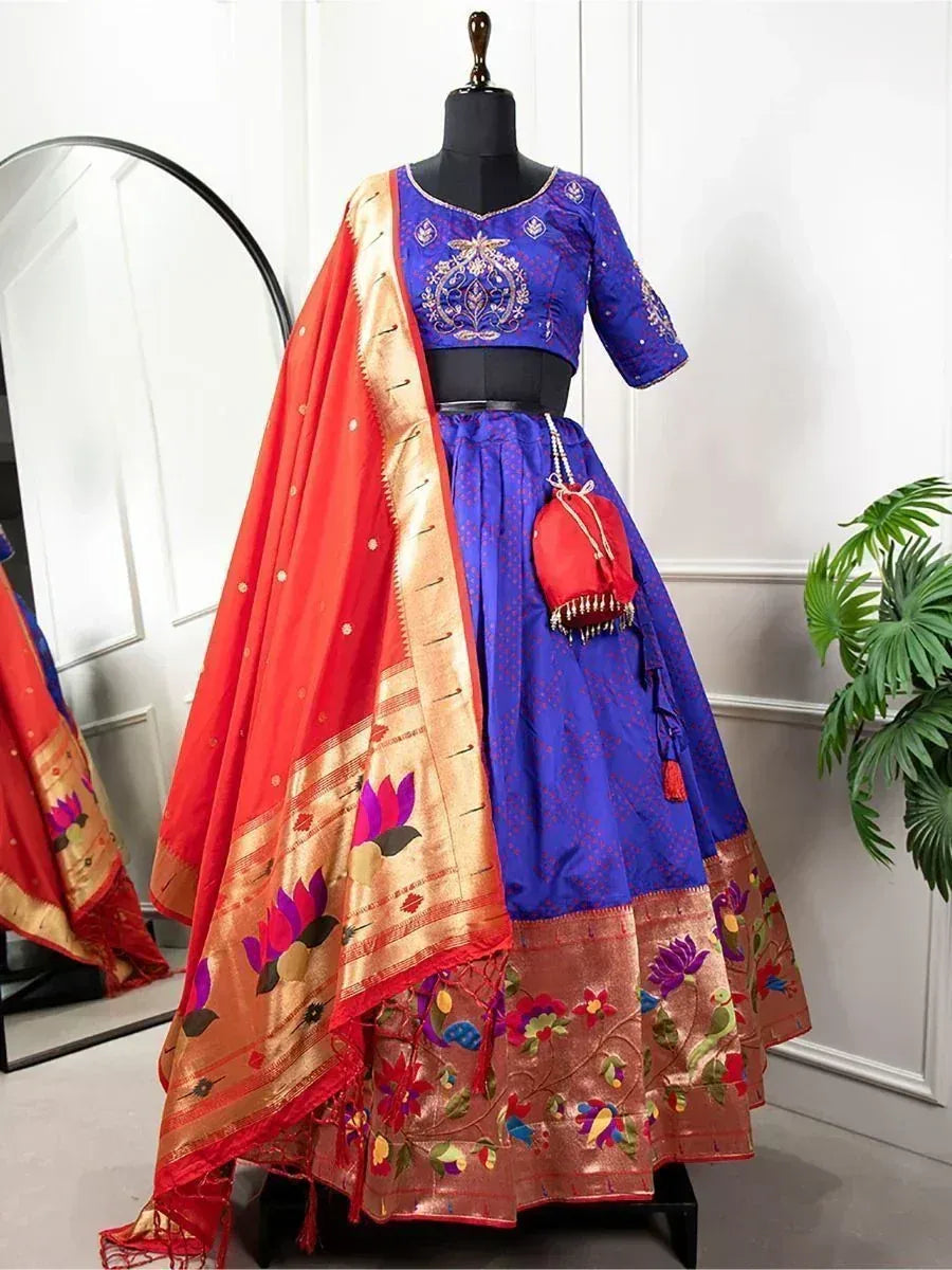Blue embroidered lehenga choli with red dupatta, floral motifs, and gold border for Indian ethnic wear