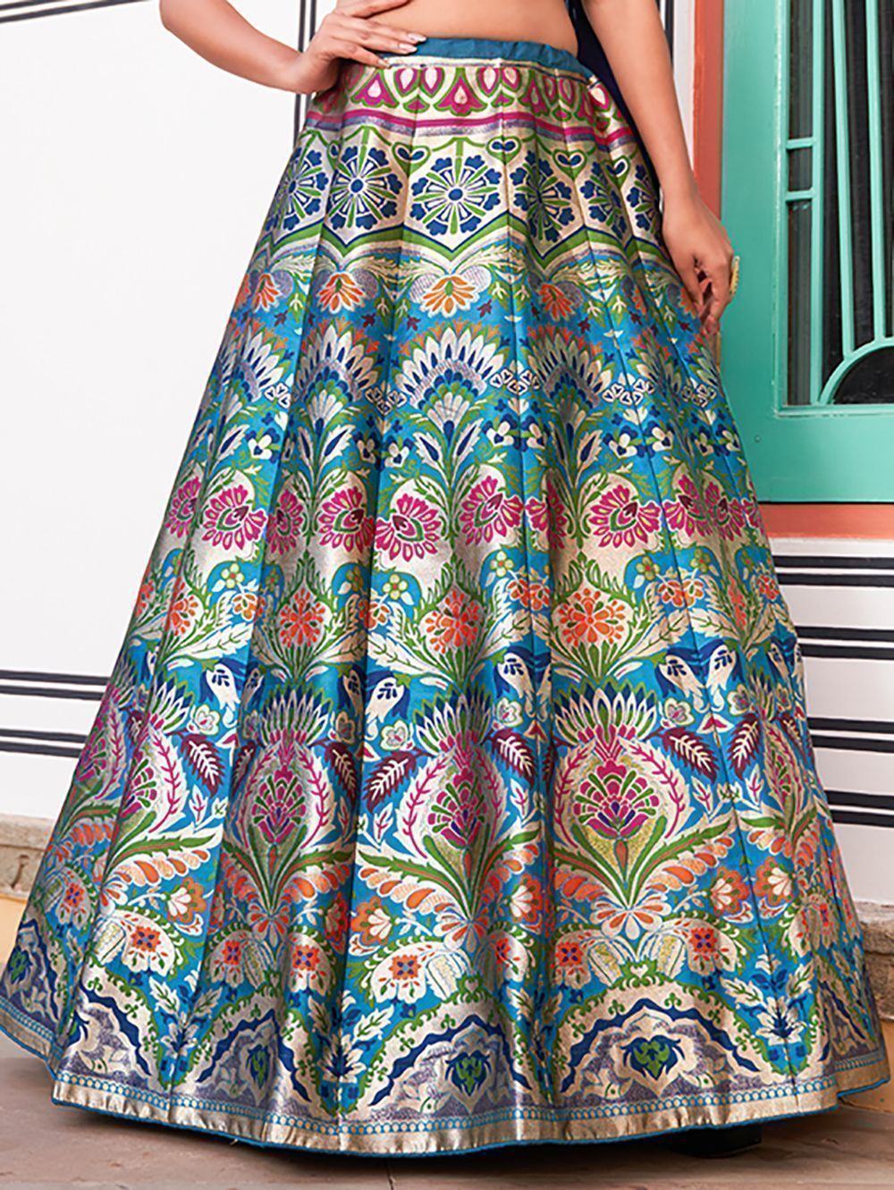 Vibrant floral printed lehenga skirt with blue, pink, and green motifs, perfect for Indian ethnic wear.