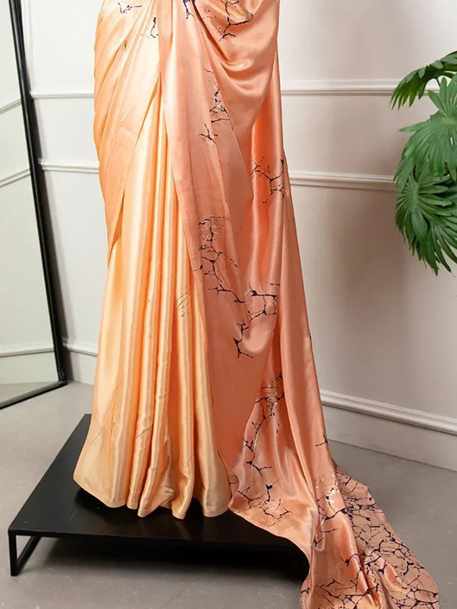 Peach silk saree with black crackle print, elegant drape for Indian ethnic wear