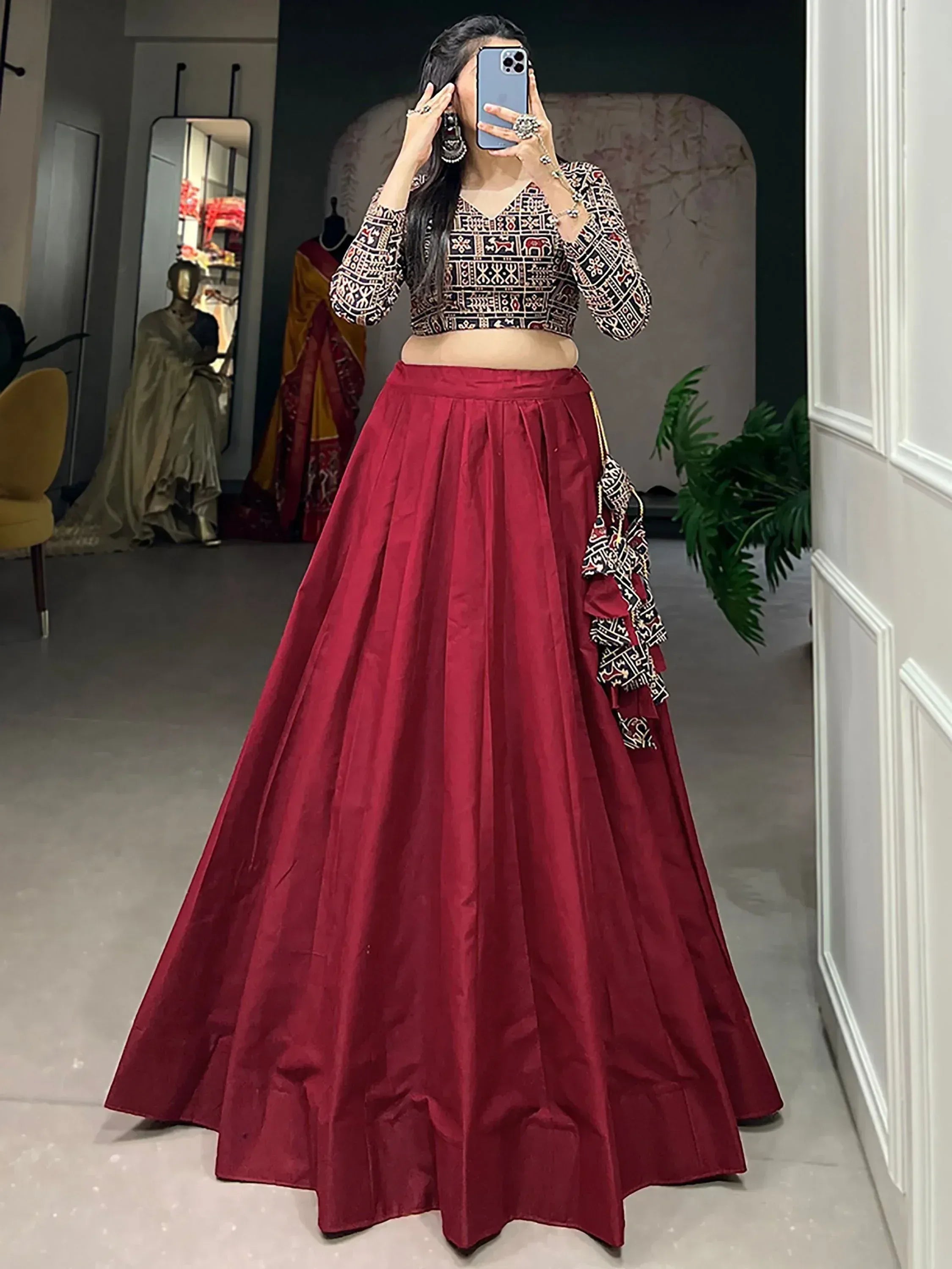 Woman in red lehenga with printed crop top, ethnic Indian wear for weddings and festivals