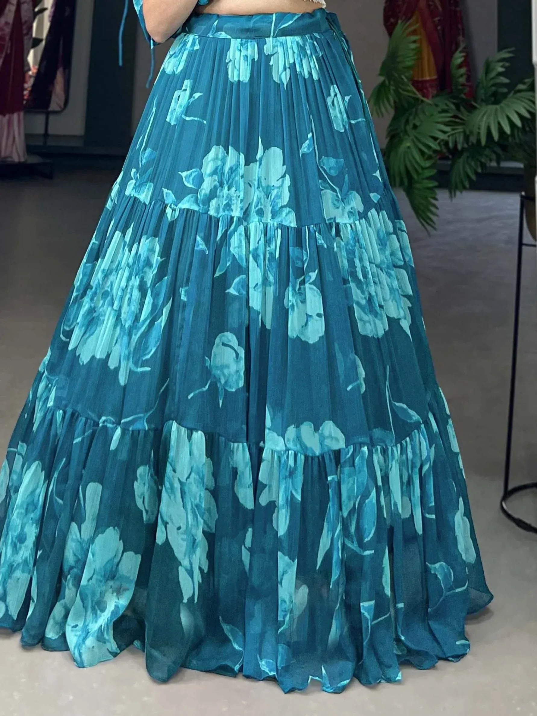 Teal floral print pleated ethnic skirt with tiered layers, perfect for Indian wear