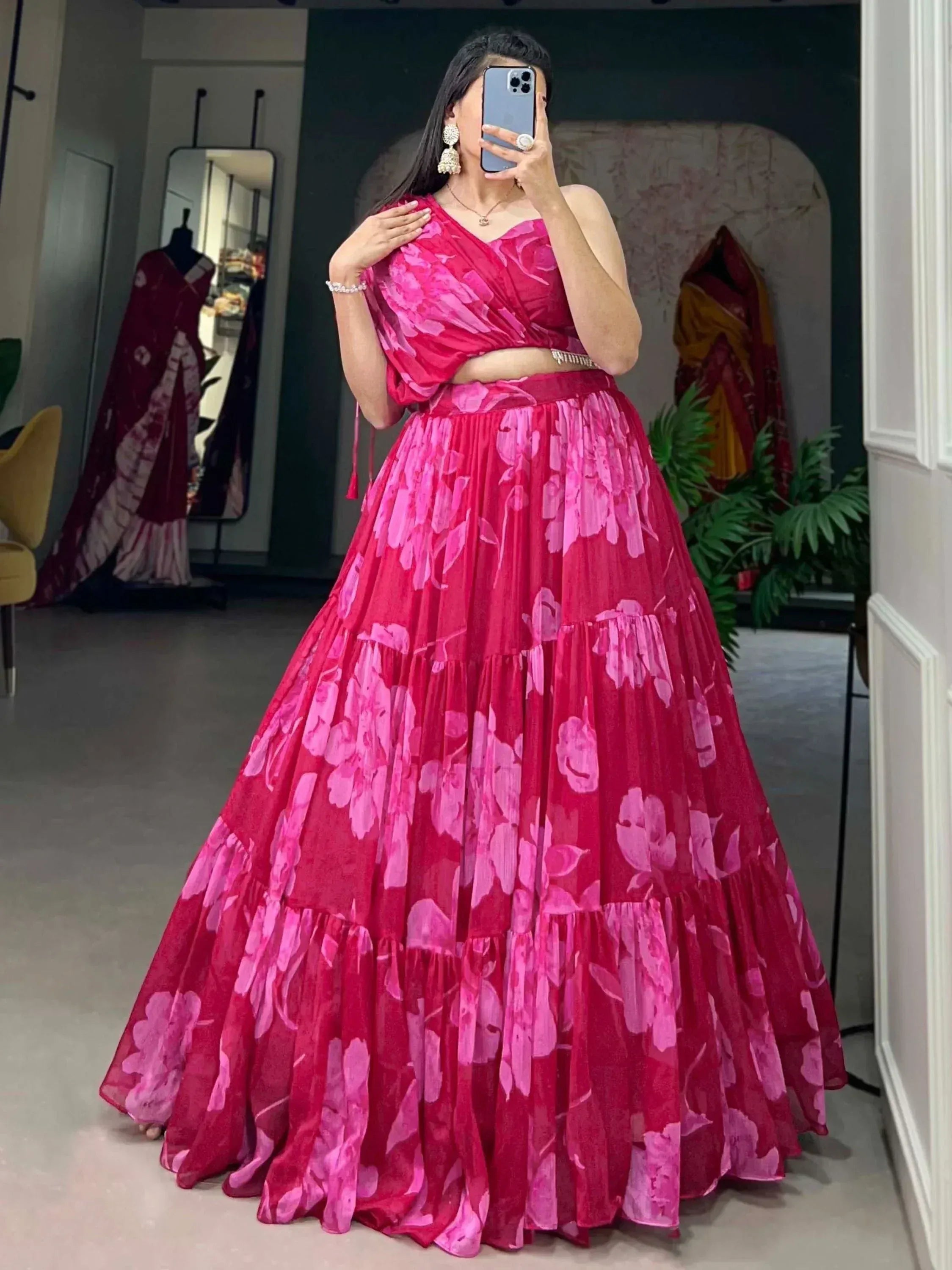 Vibrant pink floral lehenga choli with tiered skirt, perfect for Indian ethnic wear occasions