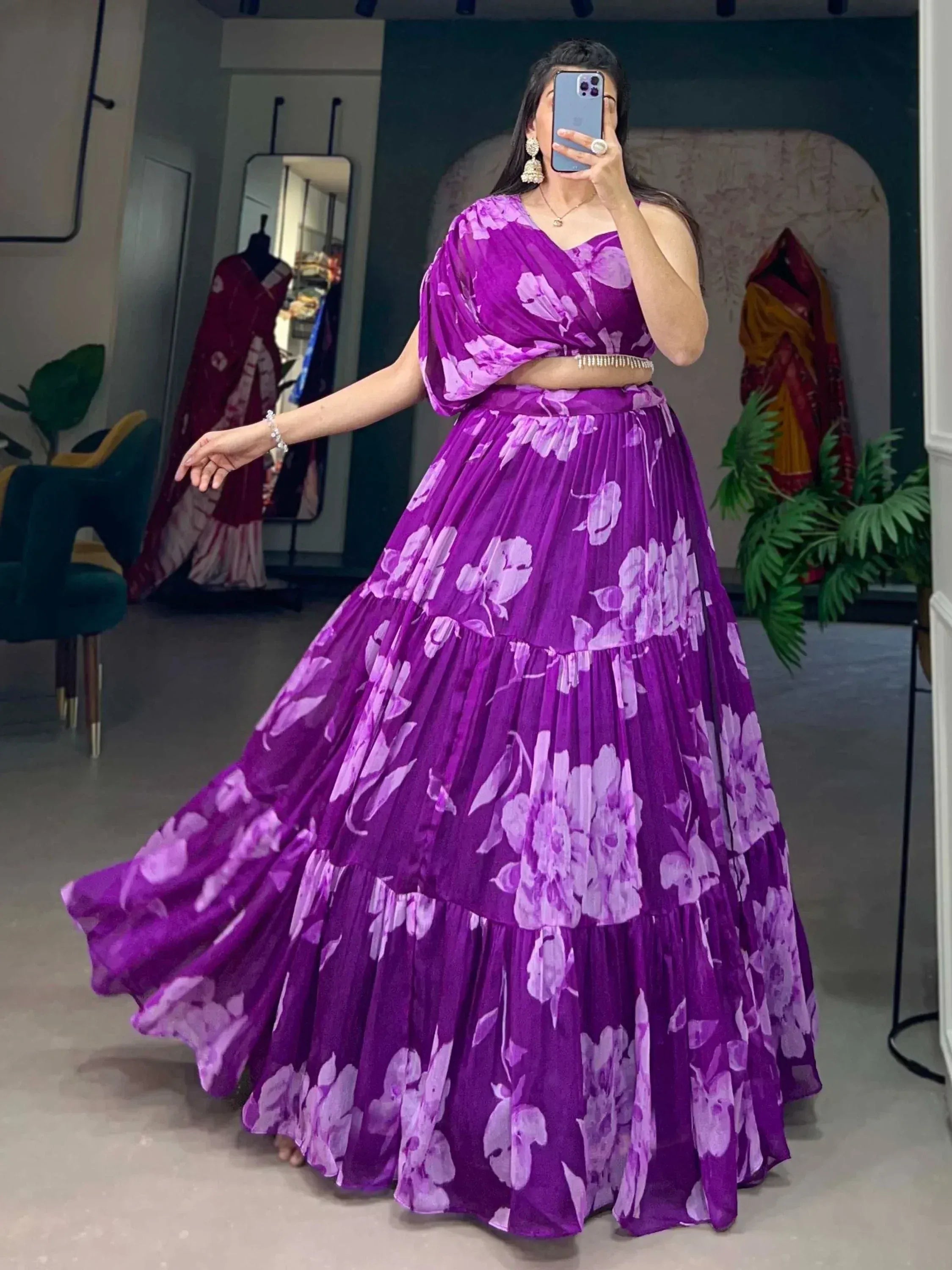 Purple floral lehenga choli with pleated skirt, perfect for Indian ethnic wear and festive occasions.