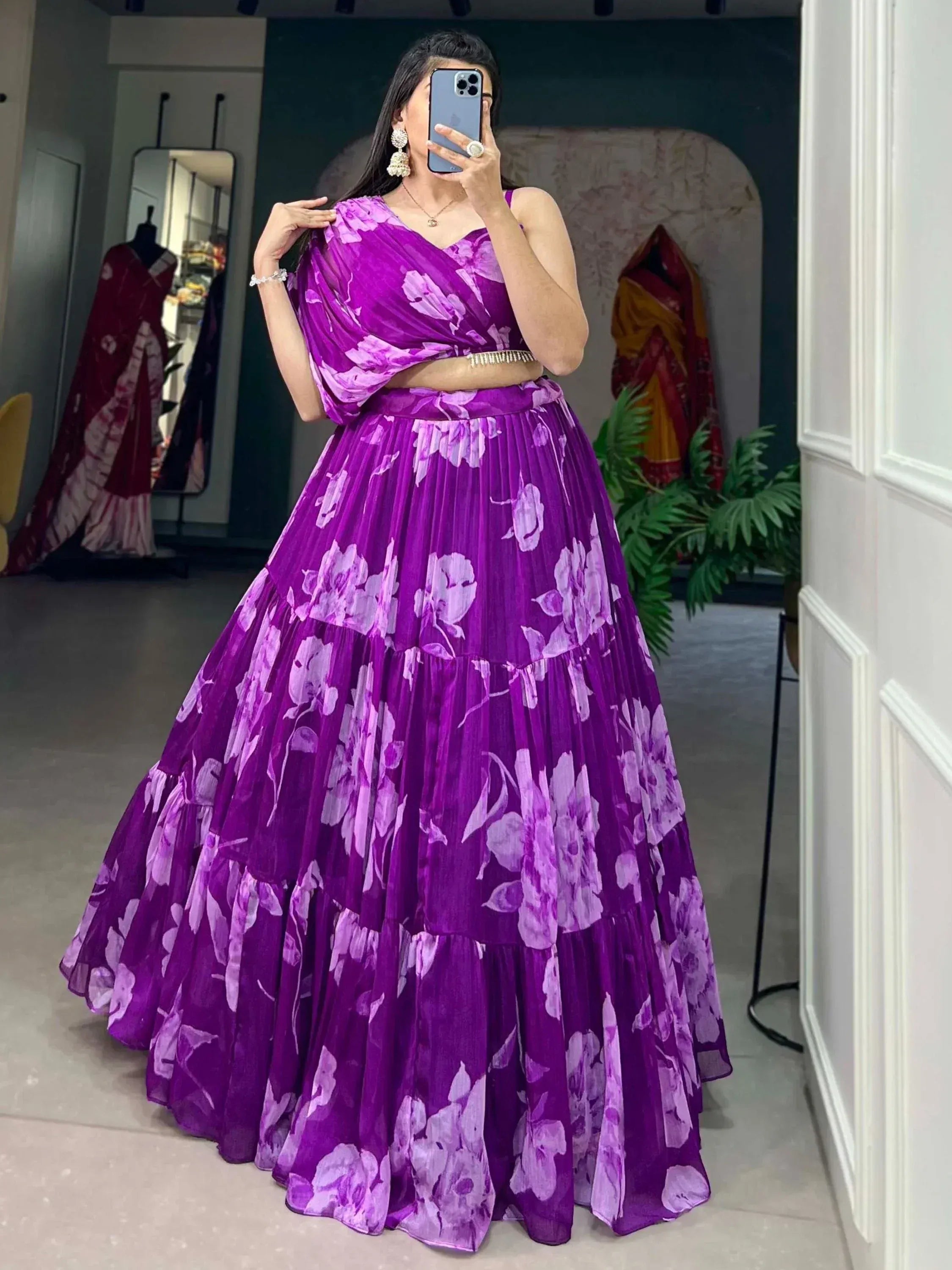 Purple floral lehenga choli with pleated skirt and draped top, perfect for Indian ethnic wear occasions