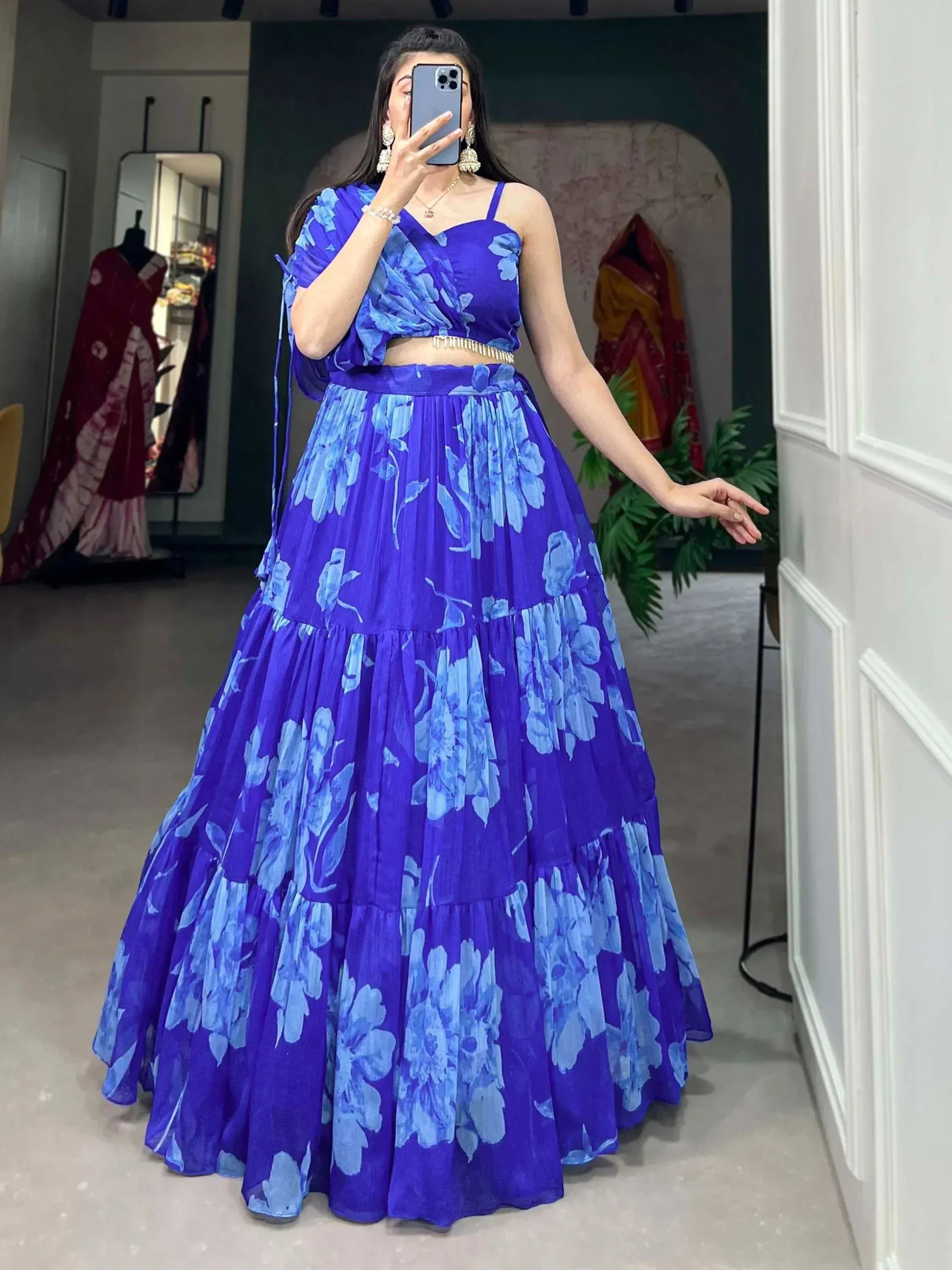 Blue floral lehenga choli with tiered skirt, perfect for Indian ethnic wear and festive occasions.