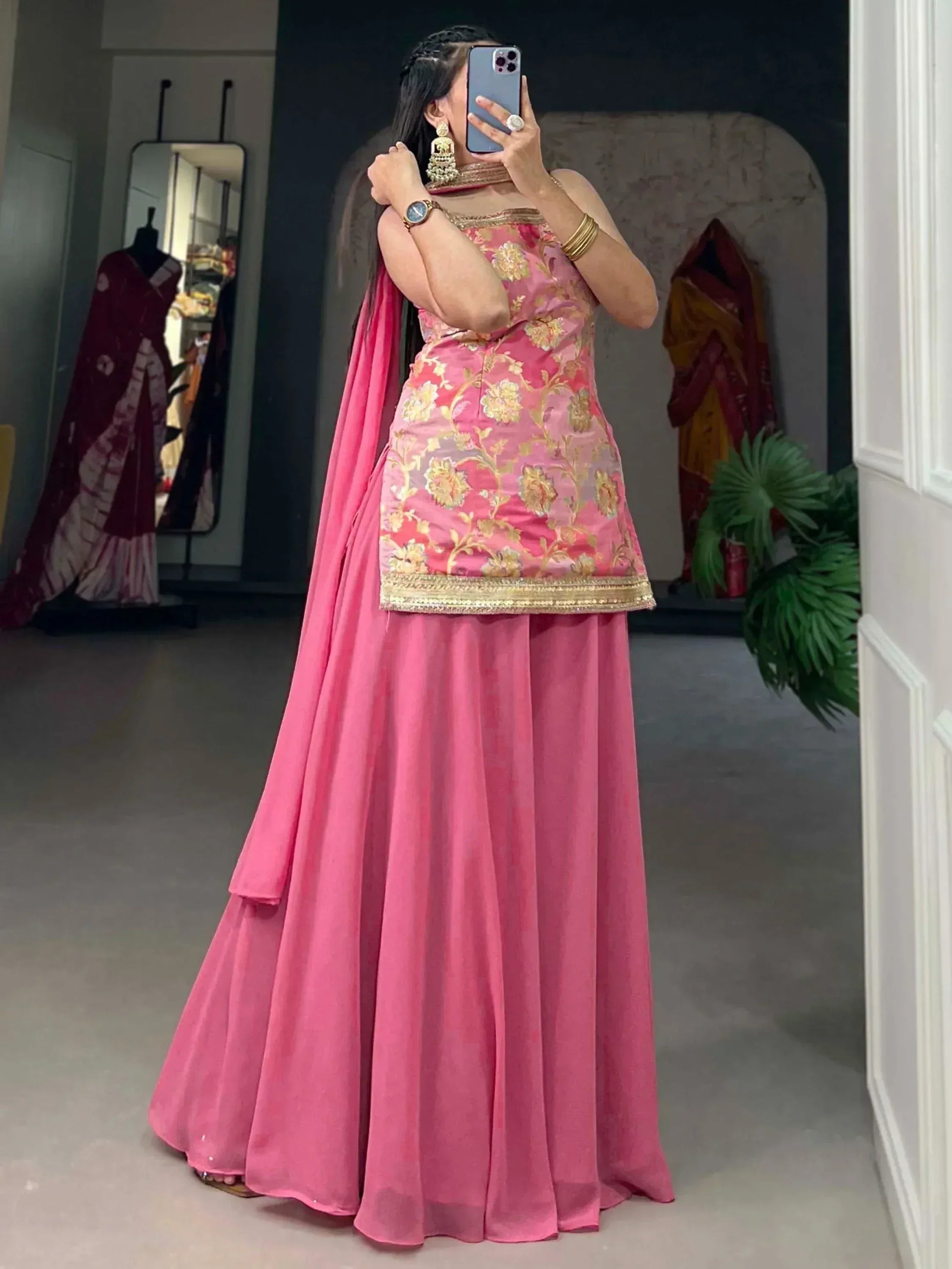 Pink floral embroidered lehenga choli with gold detailing, perfect for Indian ethnic wear occasions.