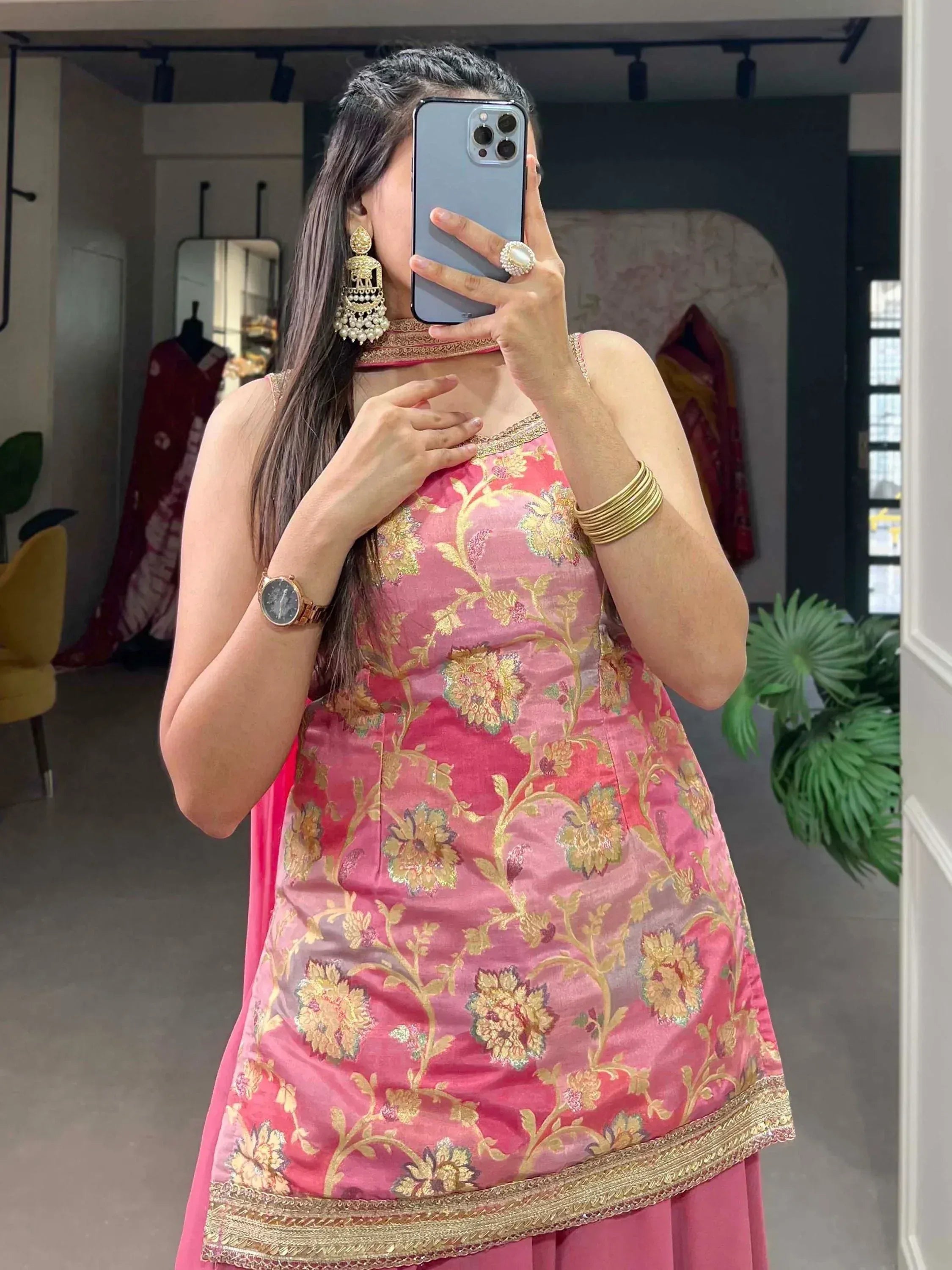 Pink floral embroidered ethnic gown with gold detailing, perfect for Indian occasions and festive wear.