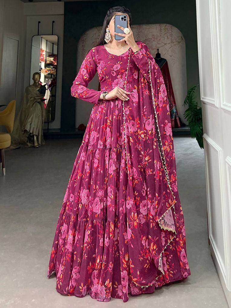 Pink floral ethnic gown with layered skirt and gold trim, perfect for Indian occasions