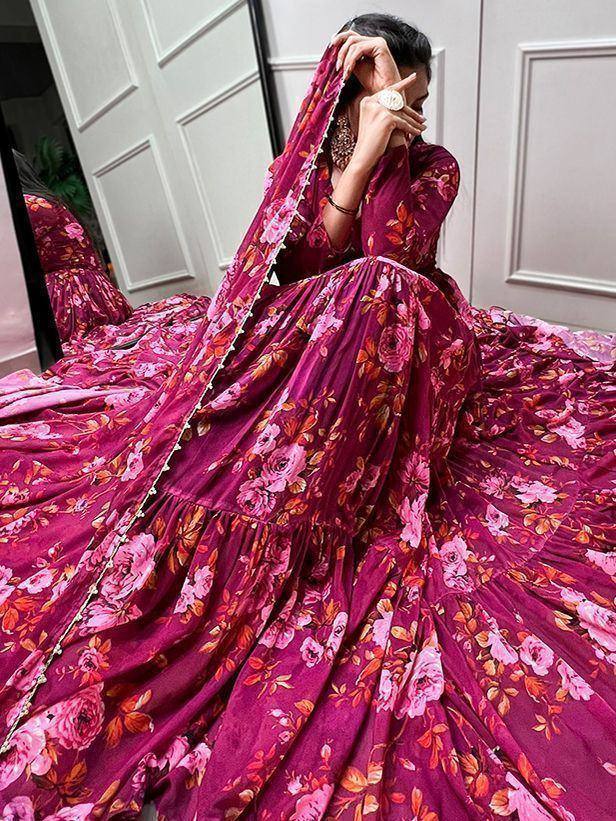 Woman in maroon floral lehenga choli with dupatta, ethnic Indian wear for weddings and events