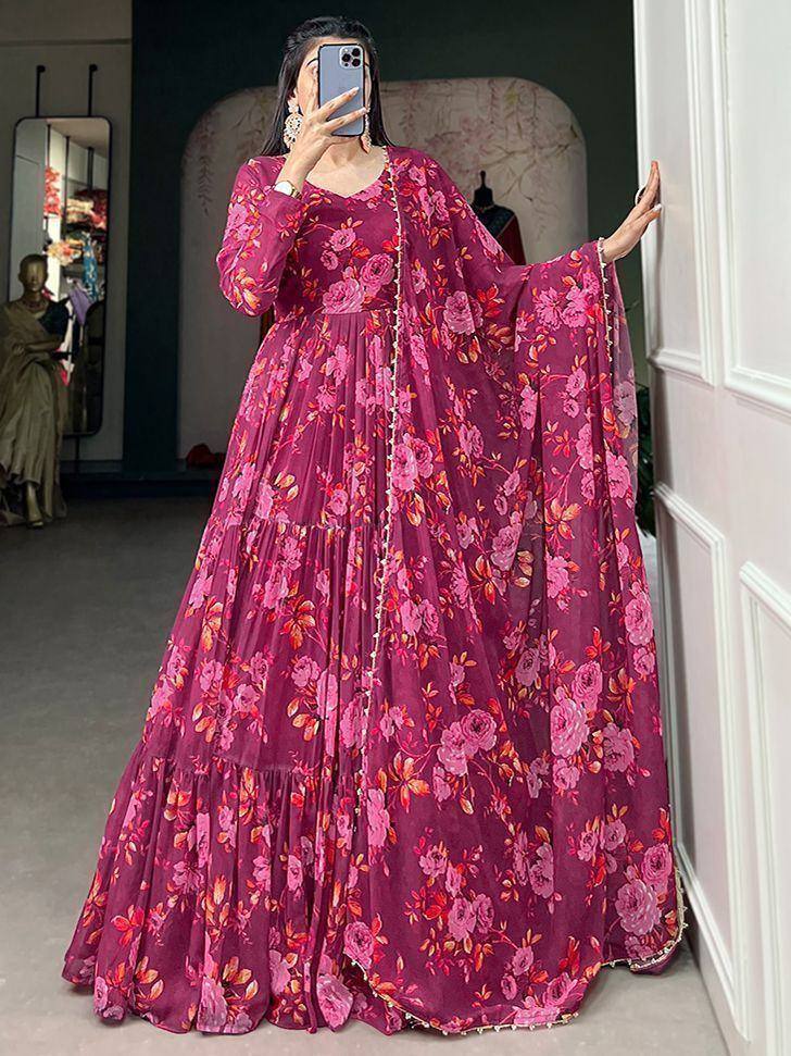 Pink floral printed ethnic gown with tiered skirt and cape sleeves, perfect for Indian occasions