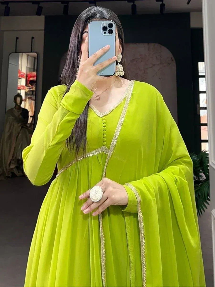 Lime green ethnic gown with gold trim, perfect for Indian festive wear and designer occasions.