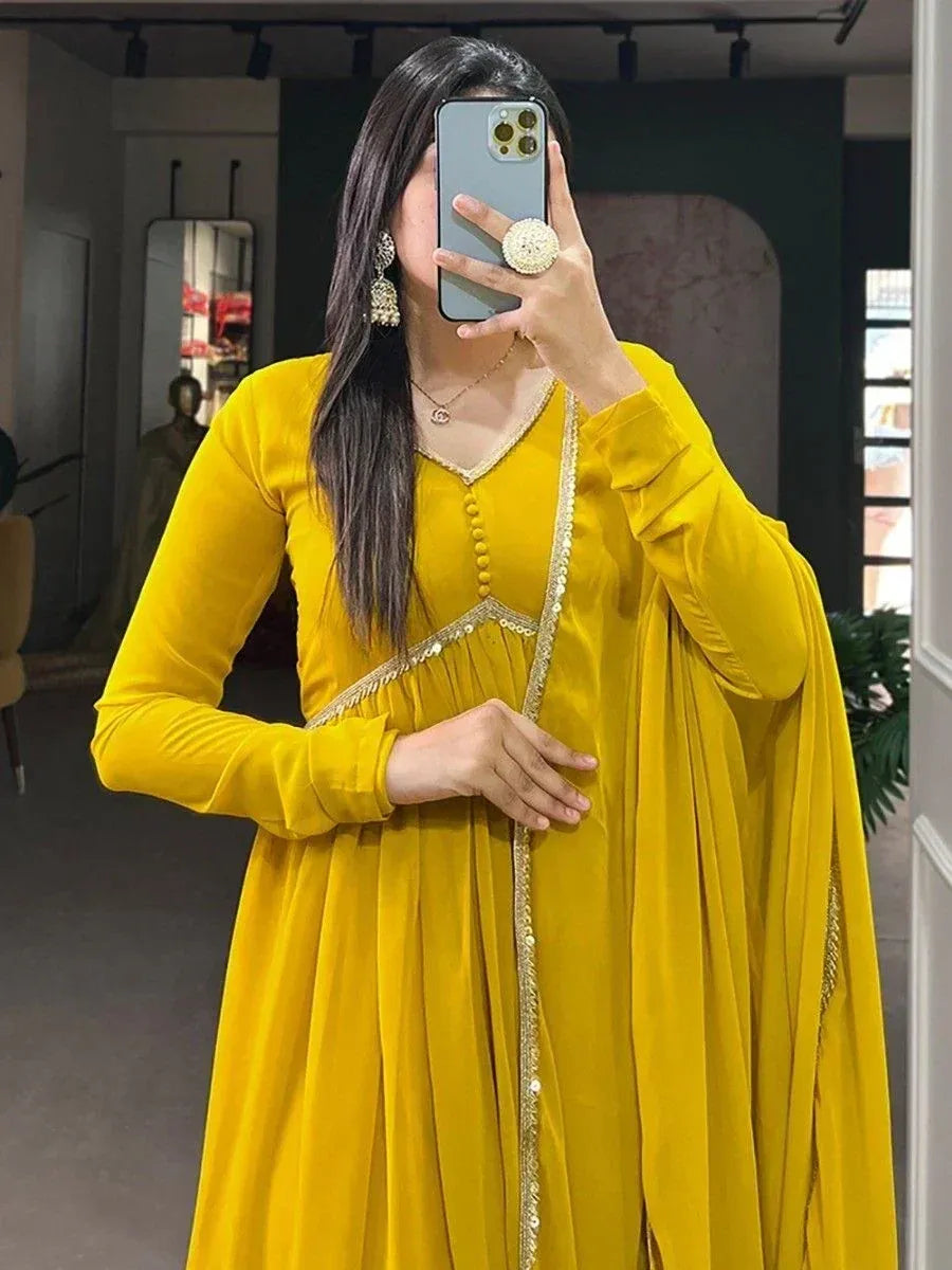 Yellow ethnic gown with gold embroidery, perfect for Indian occasions and festive wear