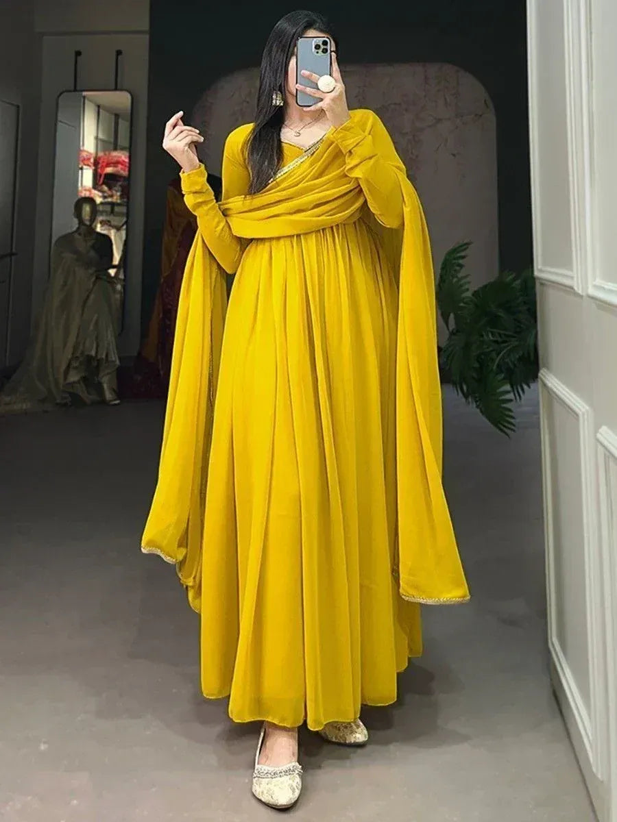 Vibrant yellow ethnic gown with draped sleeves, perfect for Indian festive occasions and parties.
