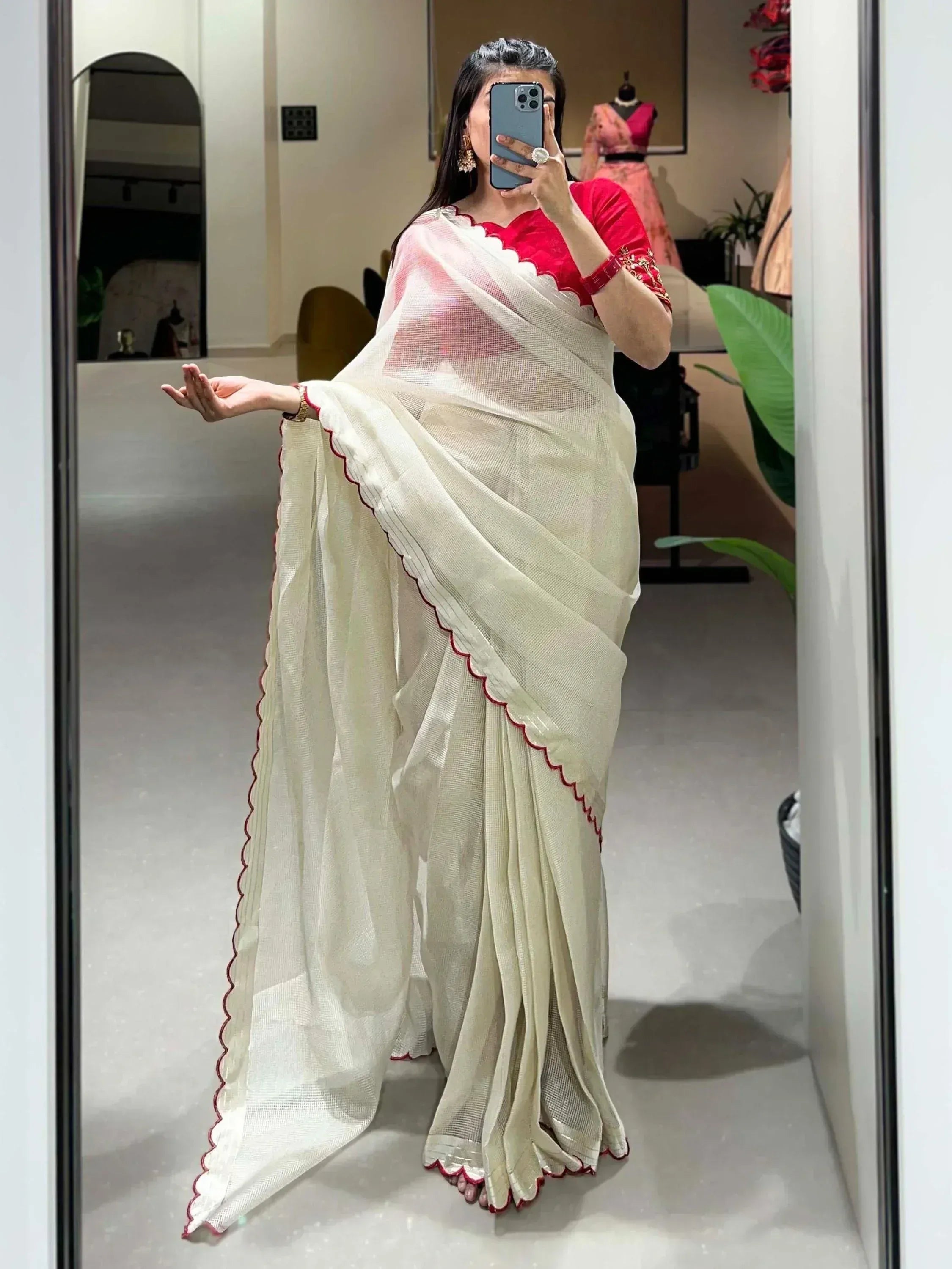 Cream saree with red scalloped border paired with red blouse, elegant Indian ethnic wear