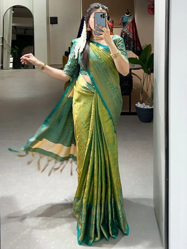 Woman in green and gold designer saree with blouse, perfect for Indian ethnic occasions