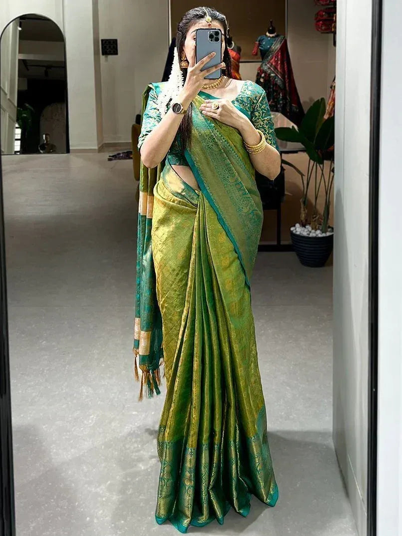 Woman in green and gold designer saree with blouse, ethnic wear for festive occasions